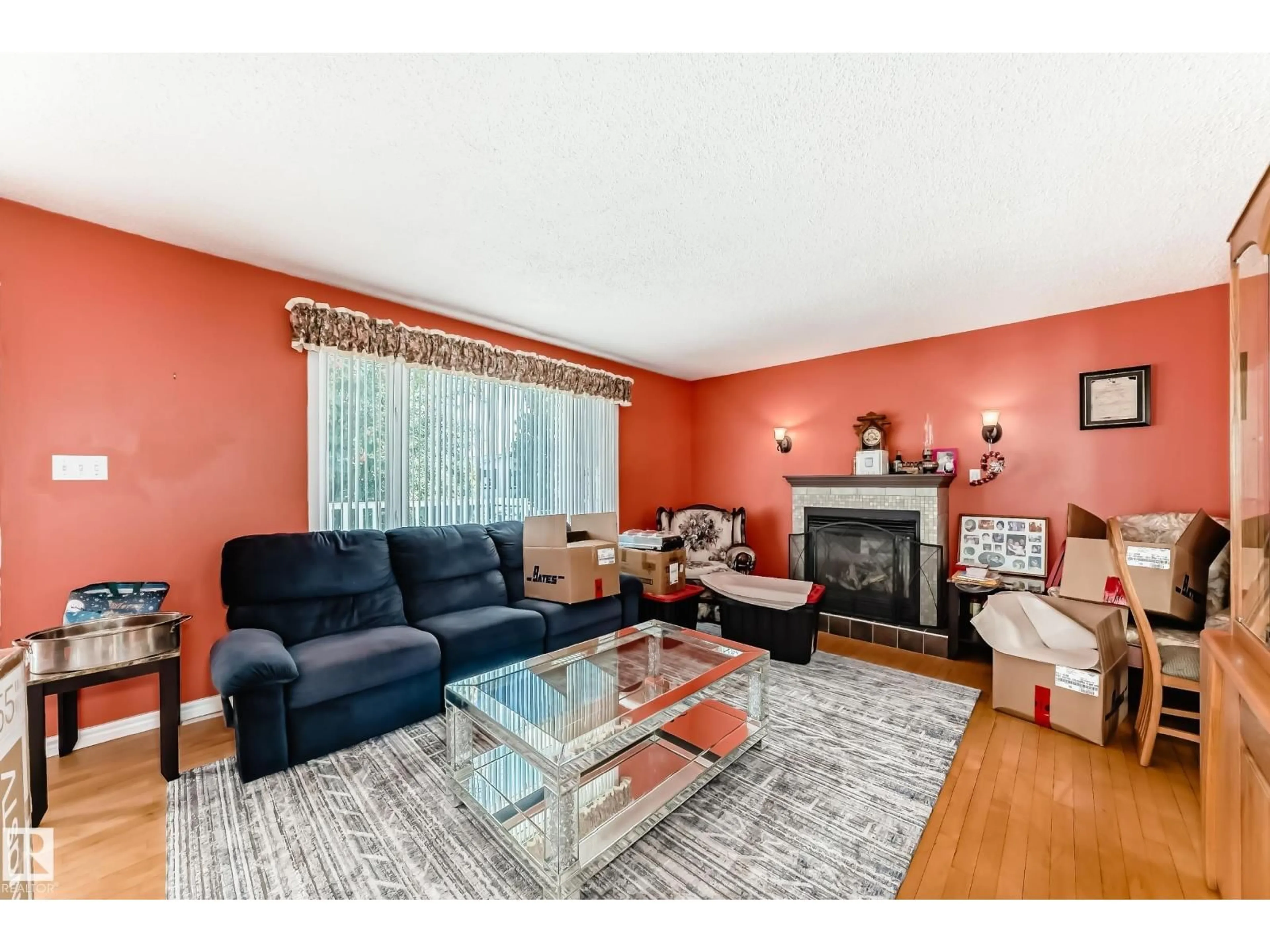 Living room with furniture, wood/laminate floor for 14252 83 ST, Edmonton Alberta T5E2X9