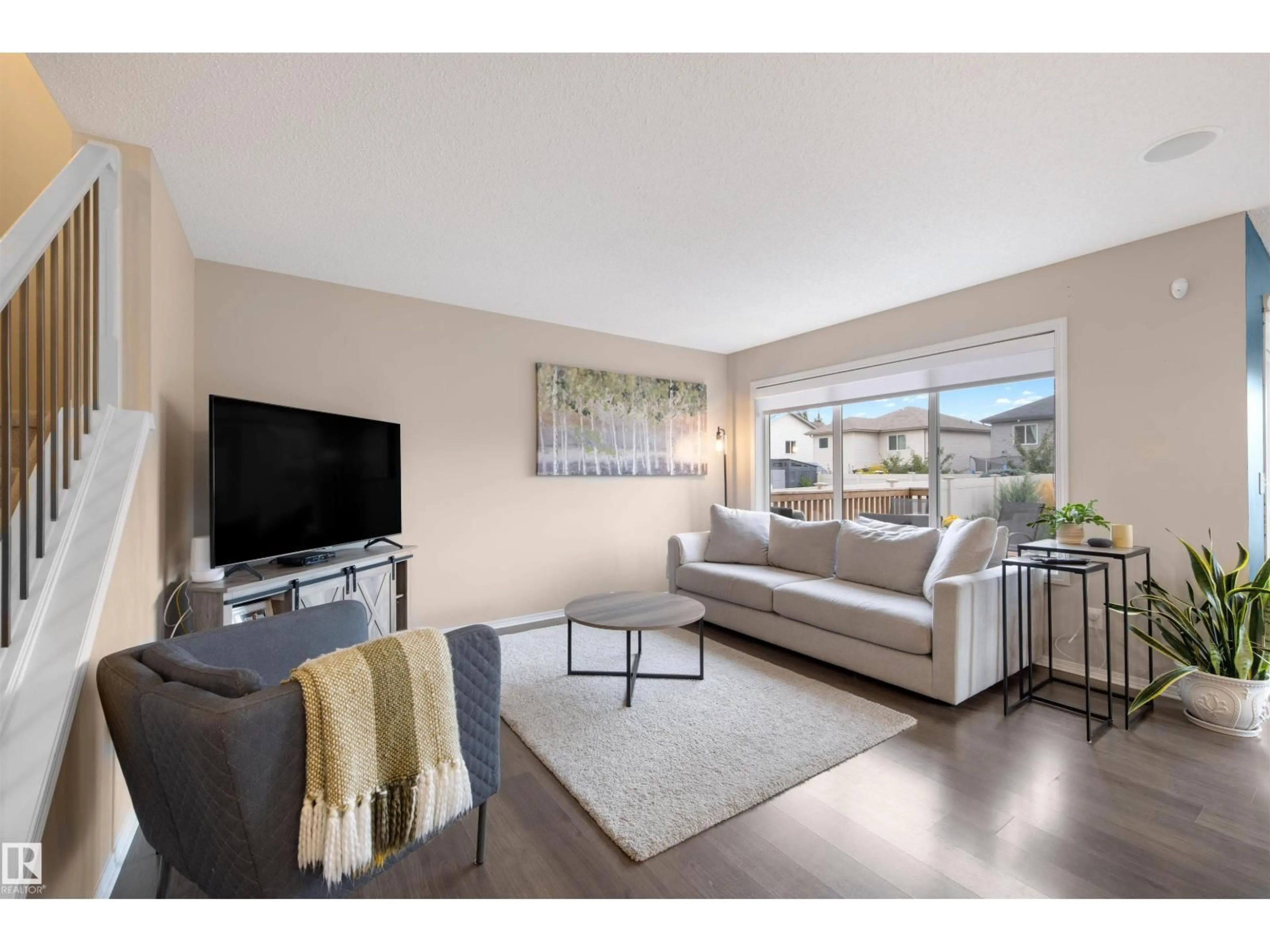 Living room with furniture, unknown for NW NW - 1728 HAMMOND CR, Edmonton Alberta T6M0N1