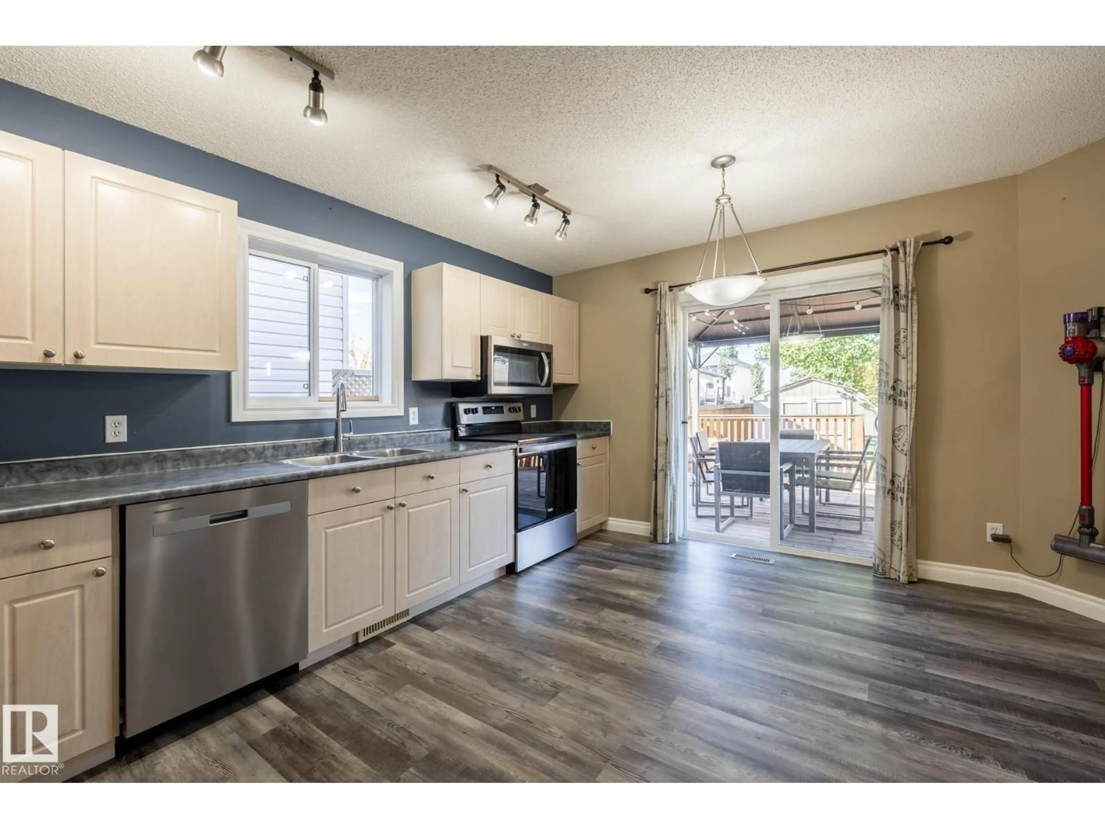 Open concept kitchen, wood/laminate floor for 628 88 ST, Edmonton Alberta T6X1E1