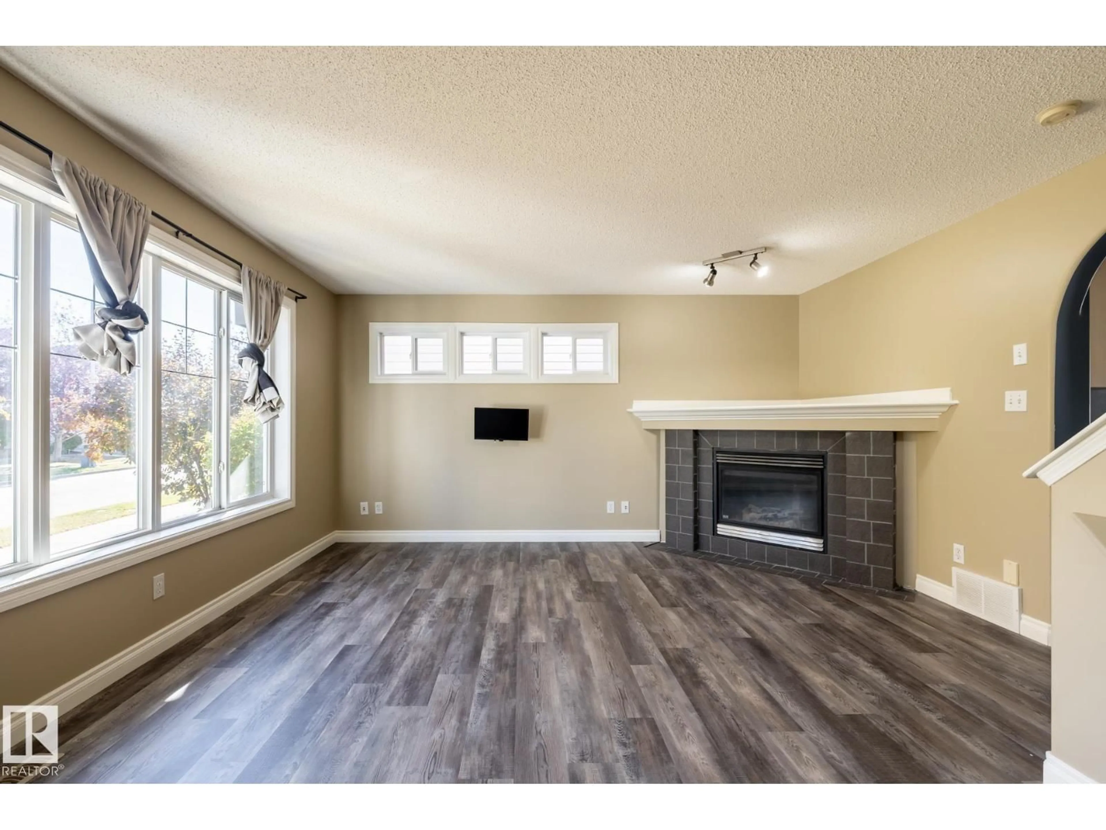 Living room with furniture, wood/laminate floor for 628 88 ST, Edmonton Alberta T6X1E1