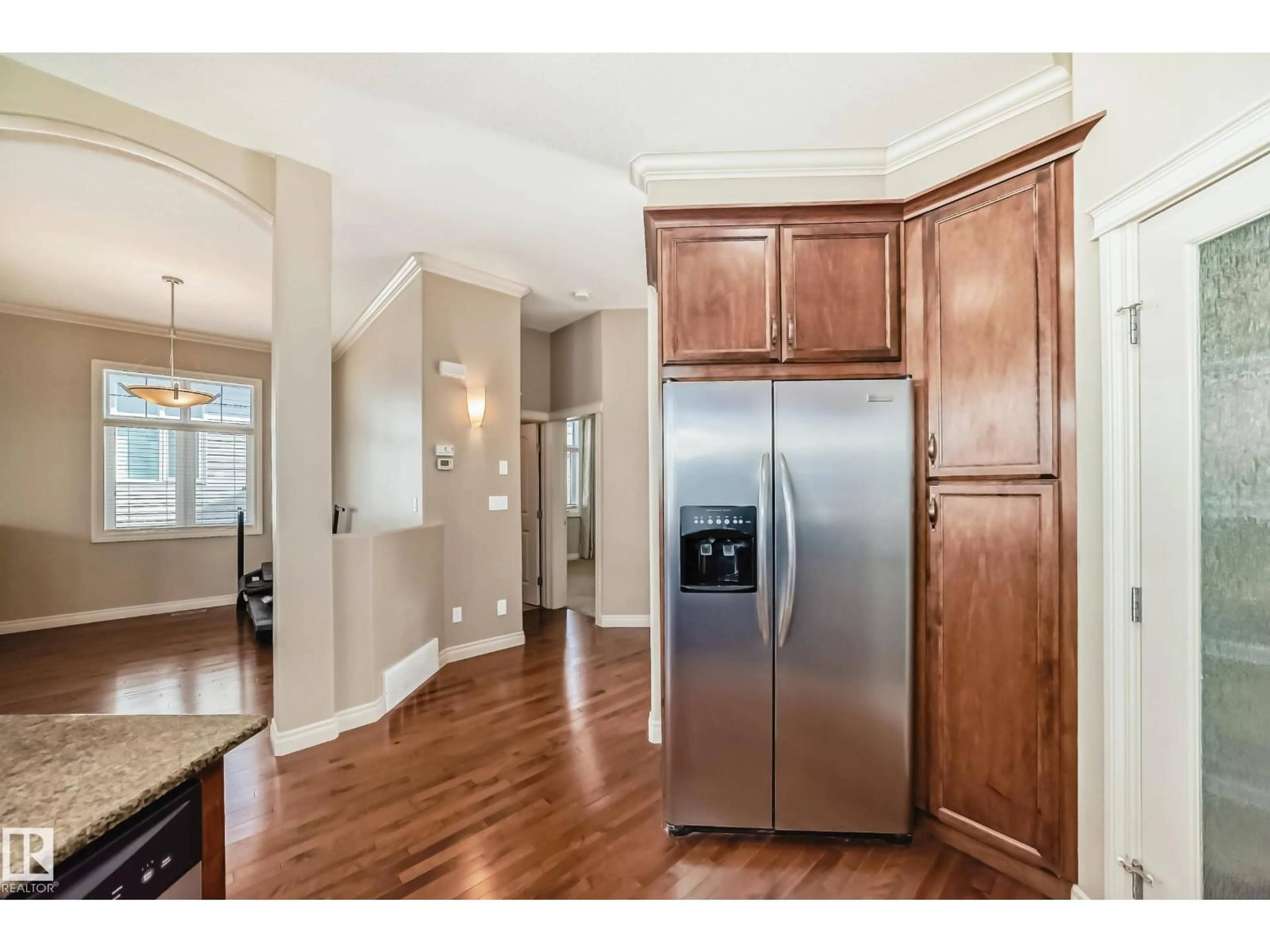 Open concept kitchen, wood/laminate floor for #13 - 12610 15 AV, Edmonton Alberta T6W1X1
