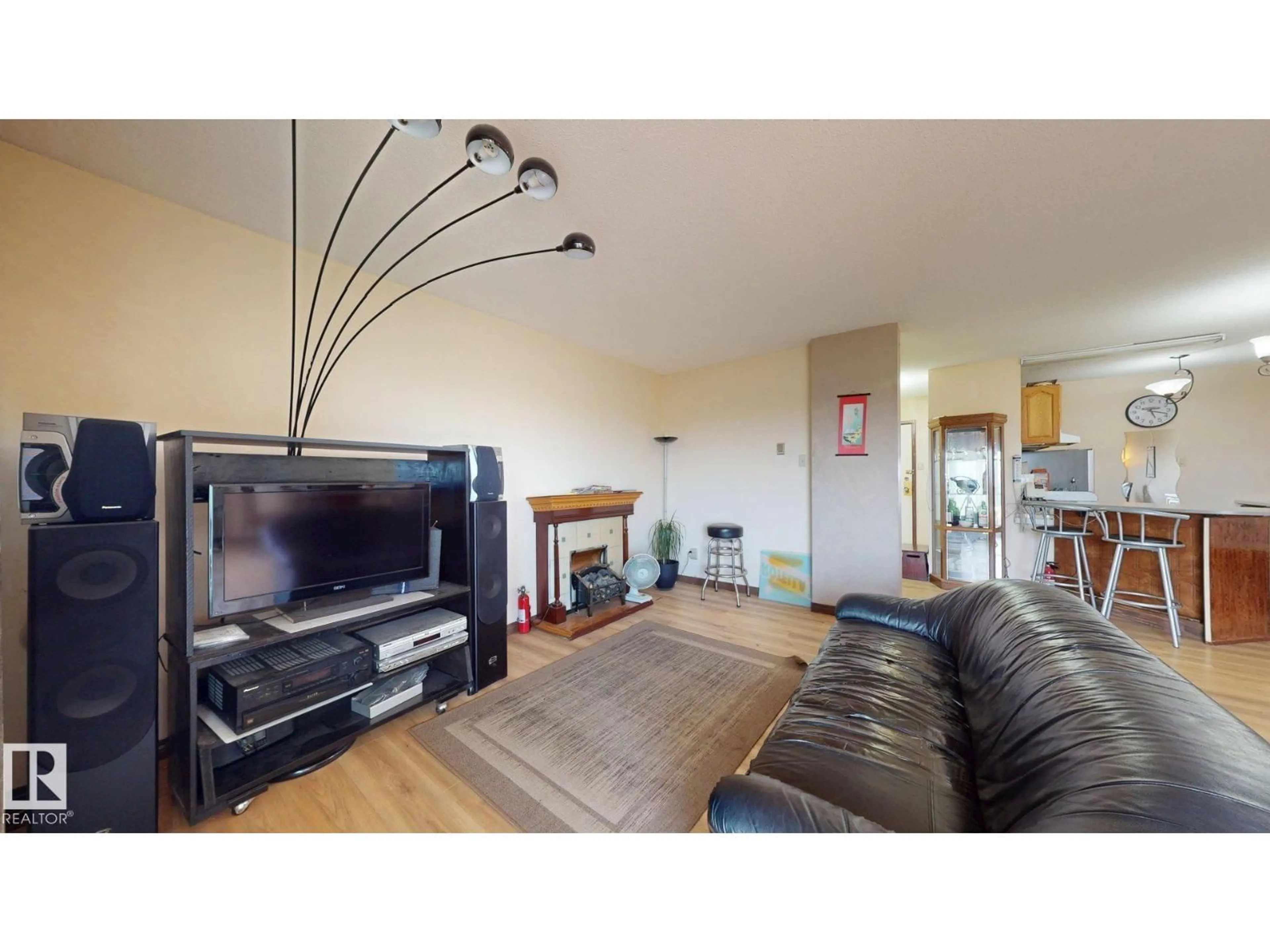 Living room with furniture, wood/laminate floor for #203 - 9028 JASPER AV, Edmonton Alberta T5H3S8
