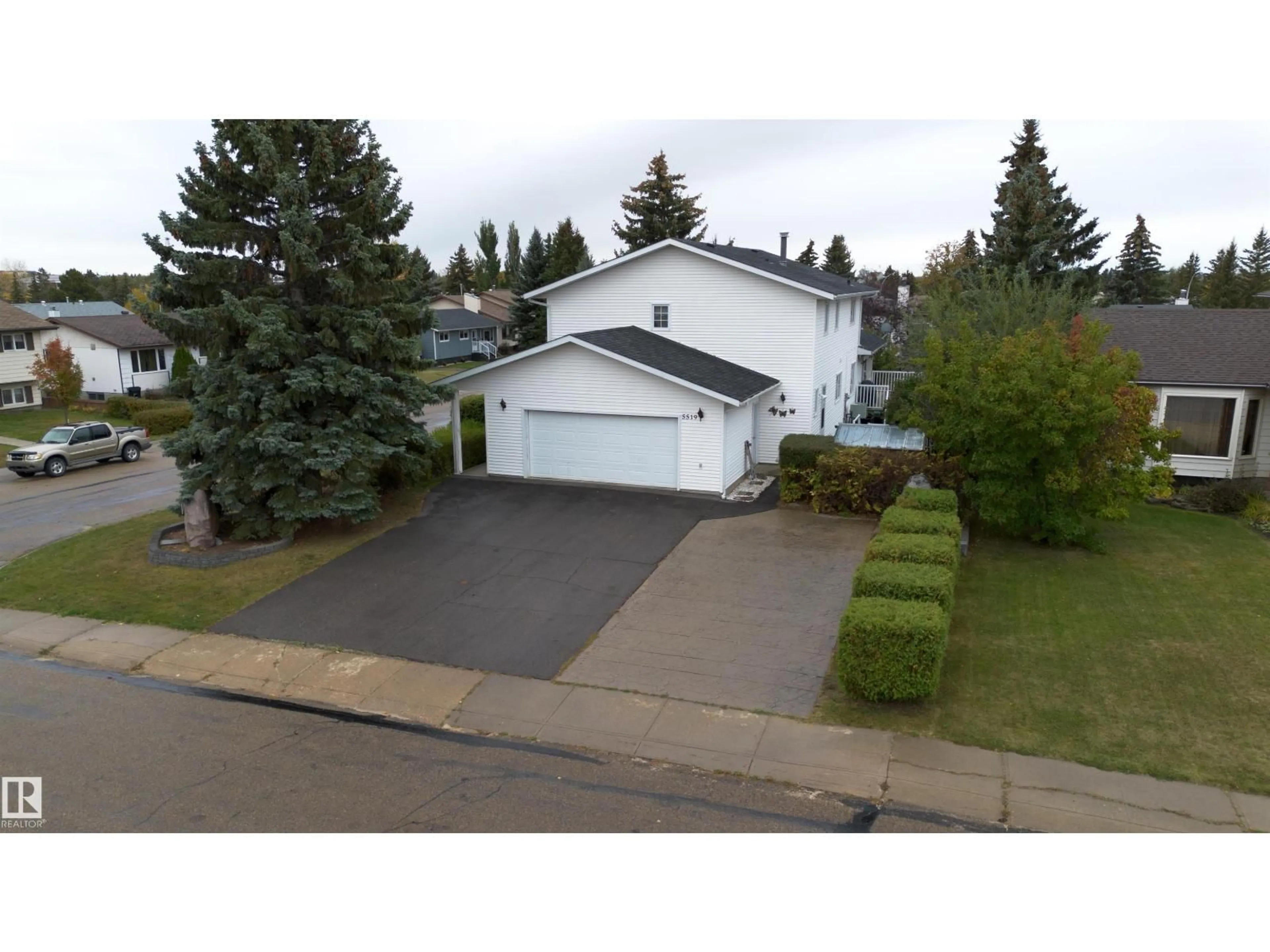 A pic from outside/outdoor area/front of a property/back of a property/a pic from drone, street for 5519 60 AVE, Barrhead Alberta T7N1C8
