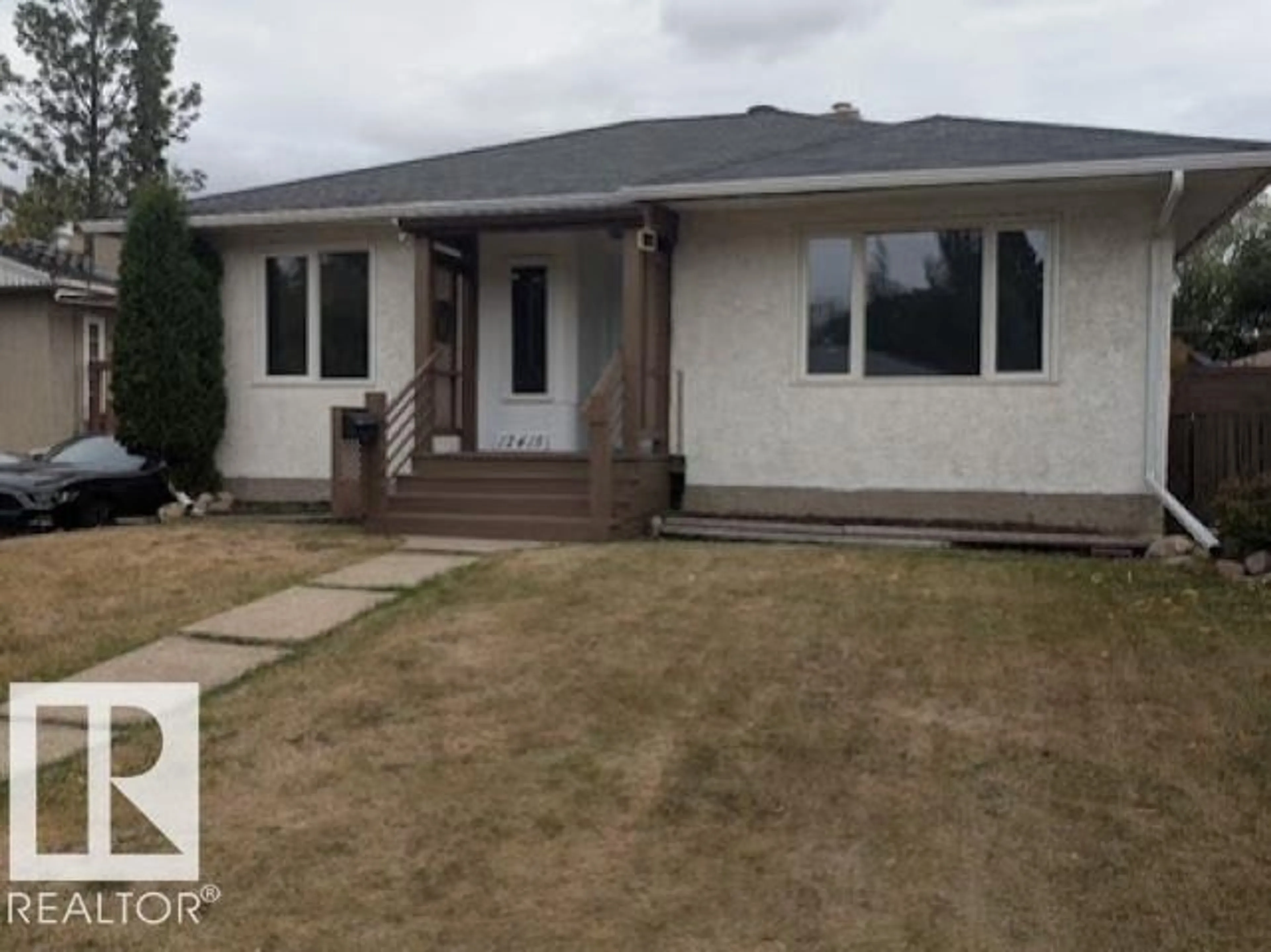 Home with vinyl exterior material, street for 12415 94 ST, Edmonton Alberta T5G1K5