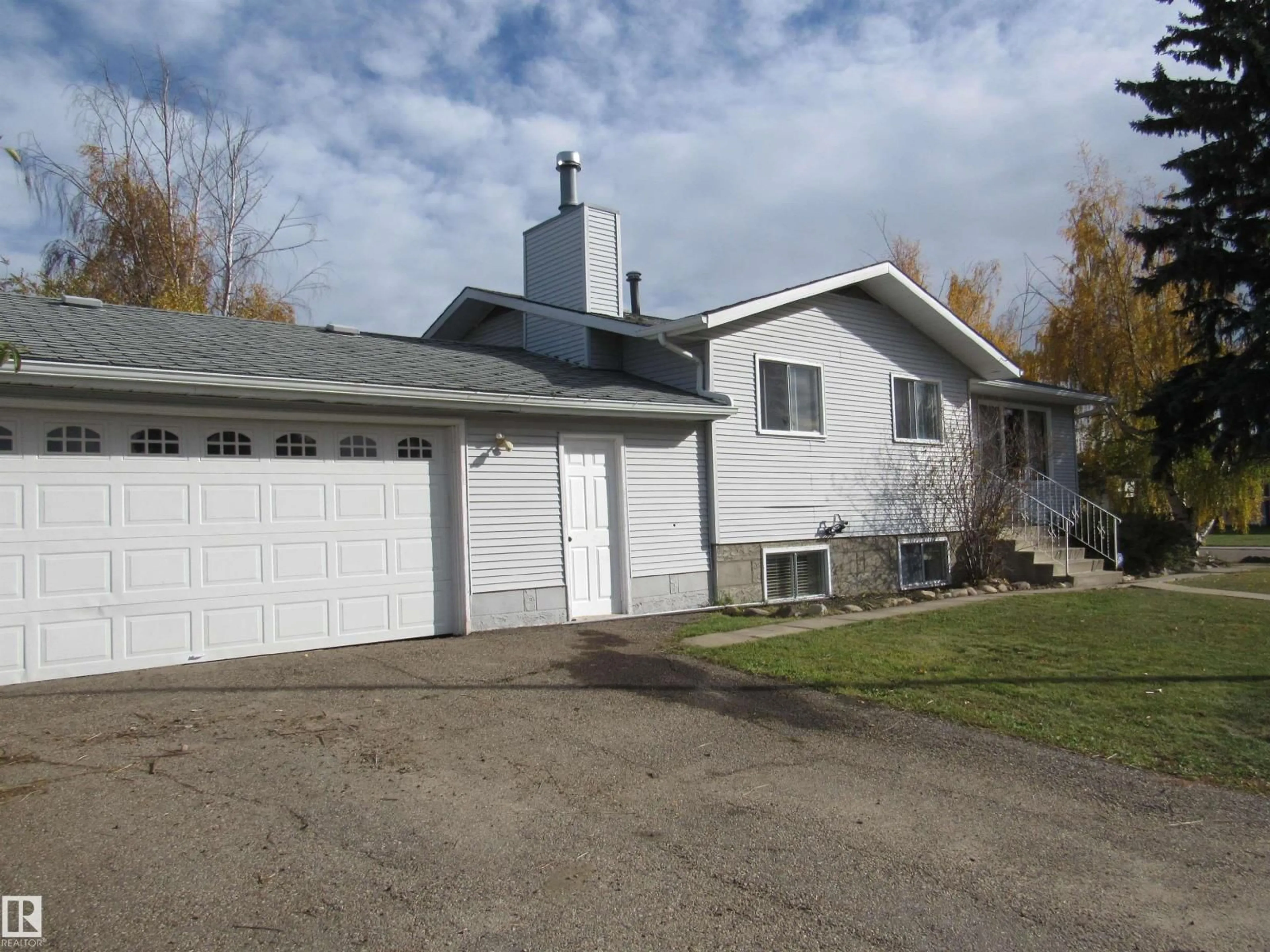 Home with vinyl exterior material, street for 5512 58 AV, Barrhead Alberta T7N1C7