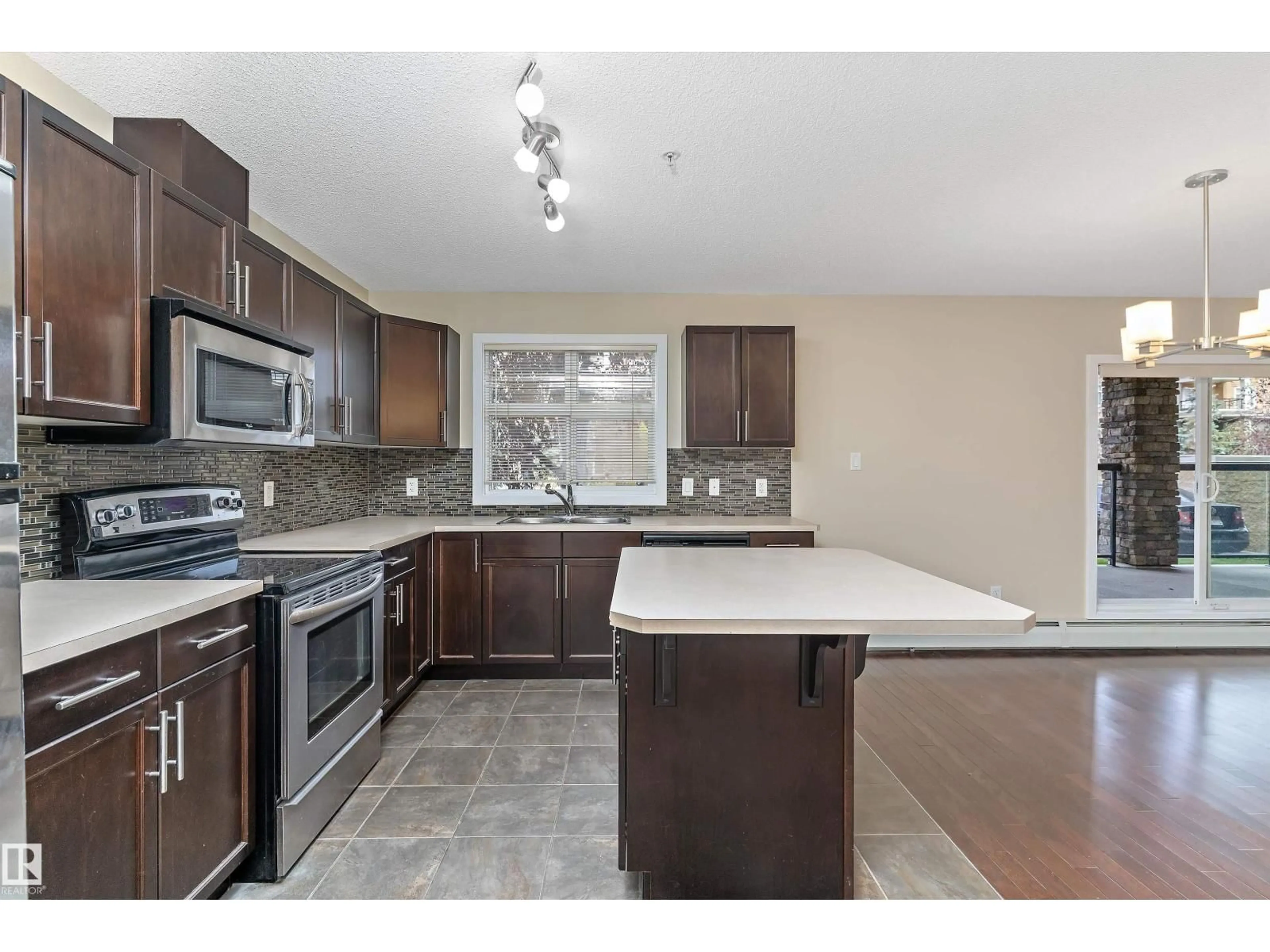 Open concept kitchen, ceramic/tile floor for #132 - 11603 ELLERSLIE RD, Edmonton Alberta T6W0J3