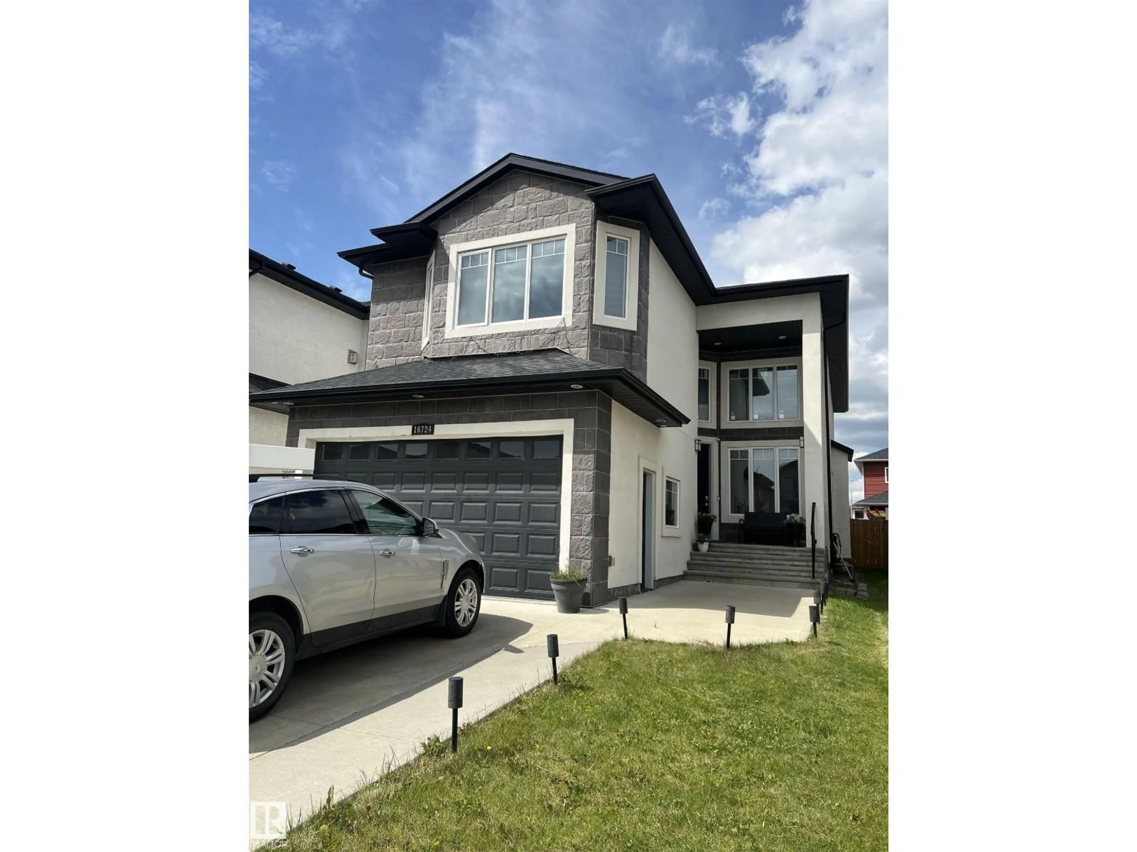 Home with vinyl exterior material, street for 16724 61 ST, Edmonton Alberta T5Y0W6