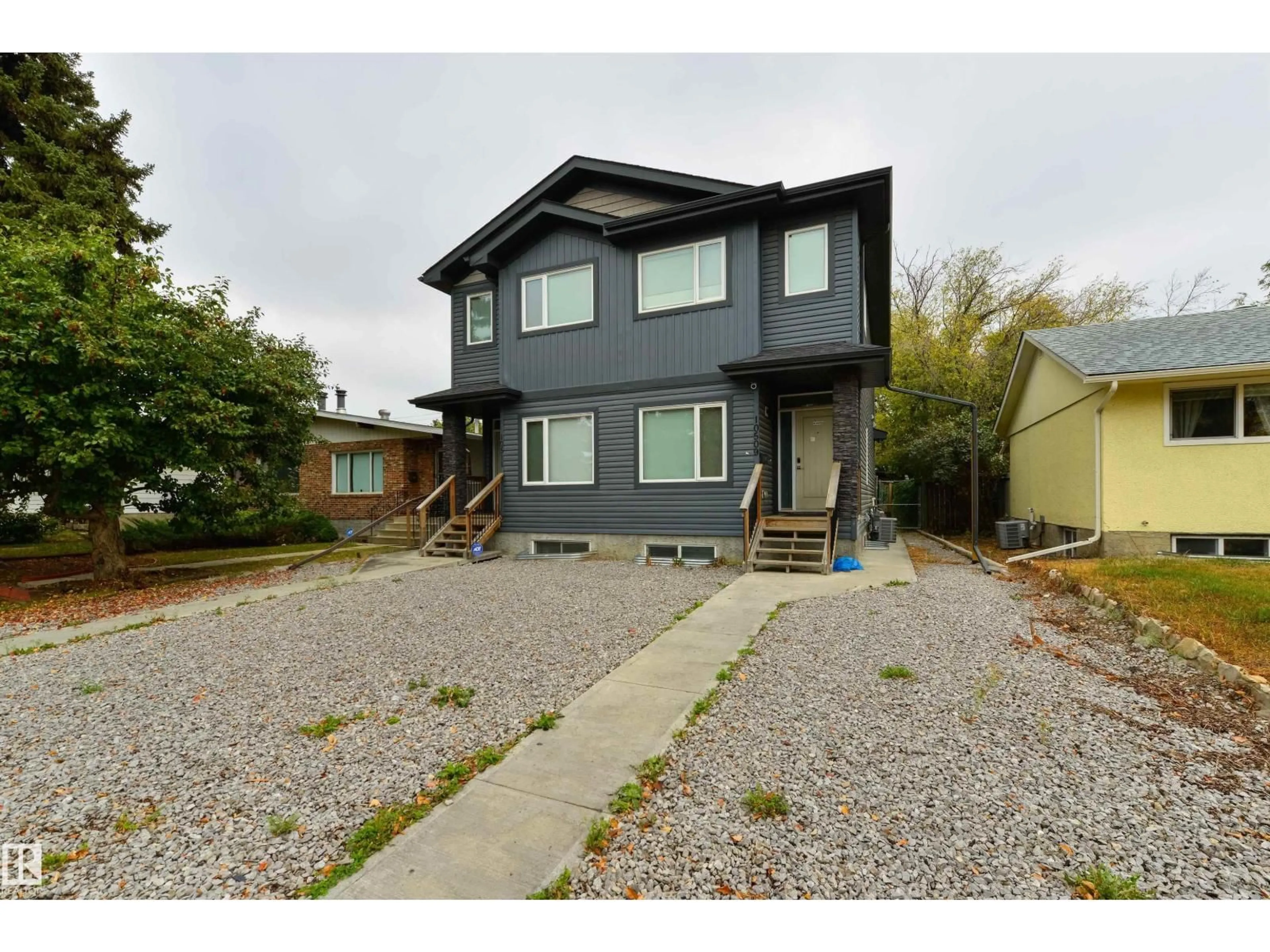 Home with vinyl exterior material, street for NW - 10509 154 ST, Edmonton Alberta T5P2J1