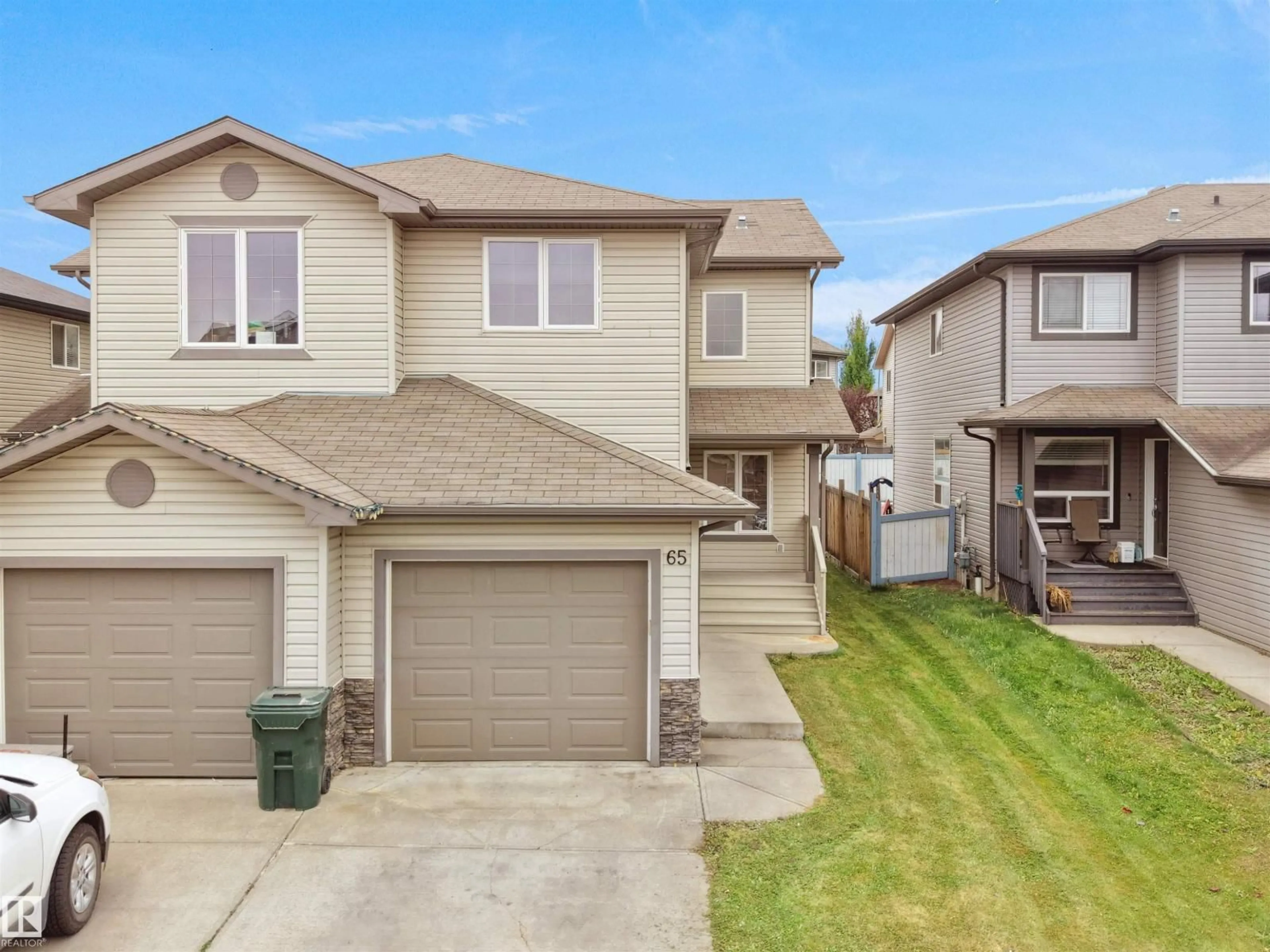 Home with vinyl exterior material, street for 65 ASHBY GD, Spruce Grove Alberta T7X0K1