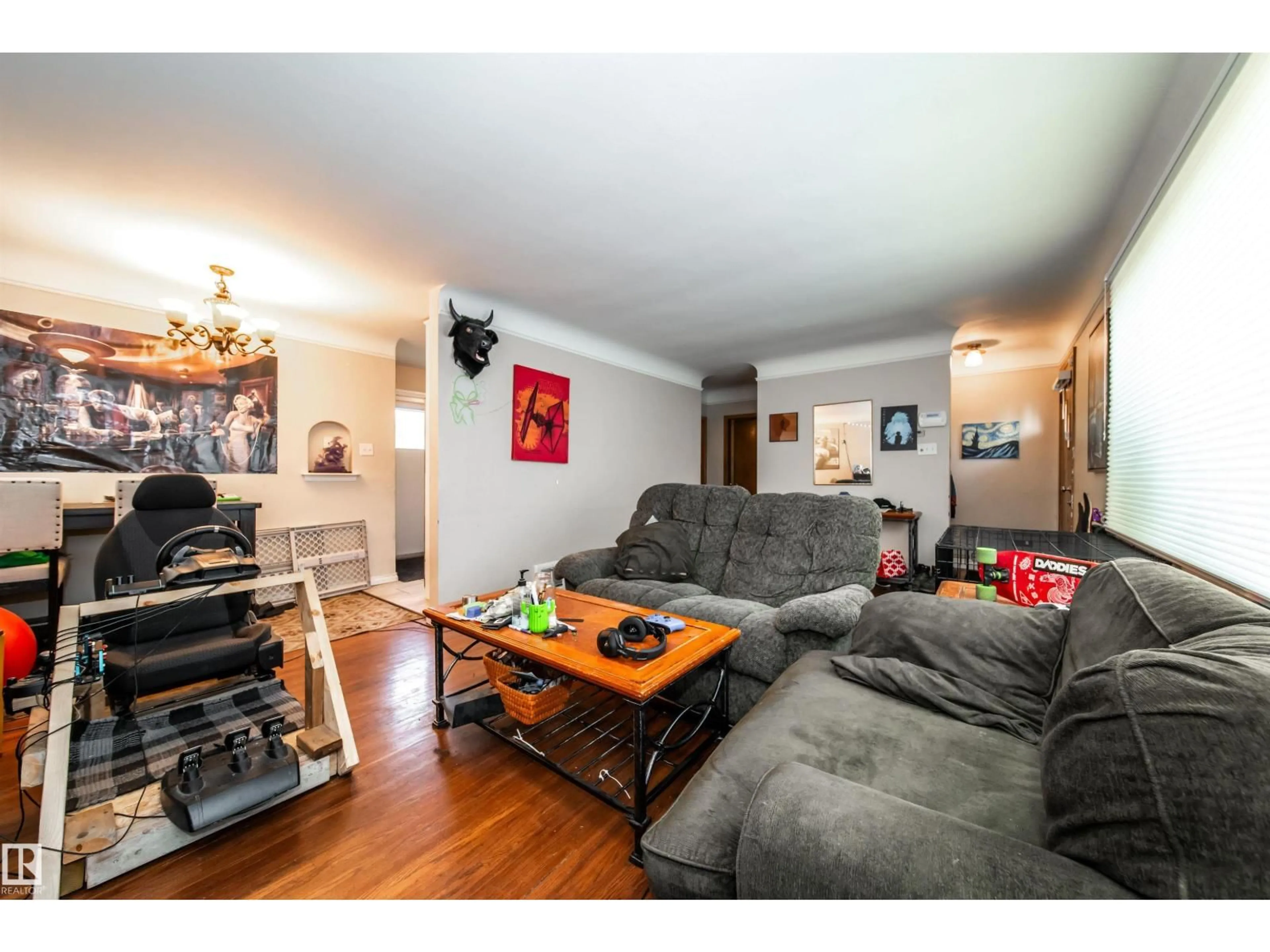 Living room with furniture, wood/laminate floor for 7910 75 ST, Edmonton Alberta T6C2G5