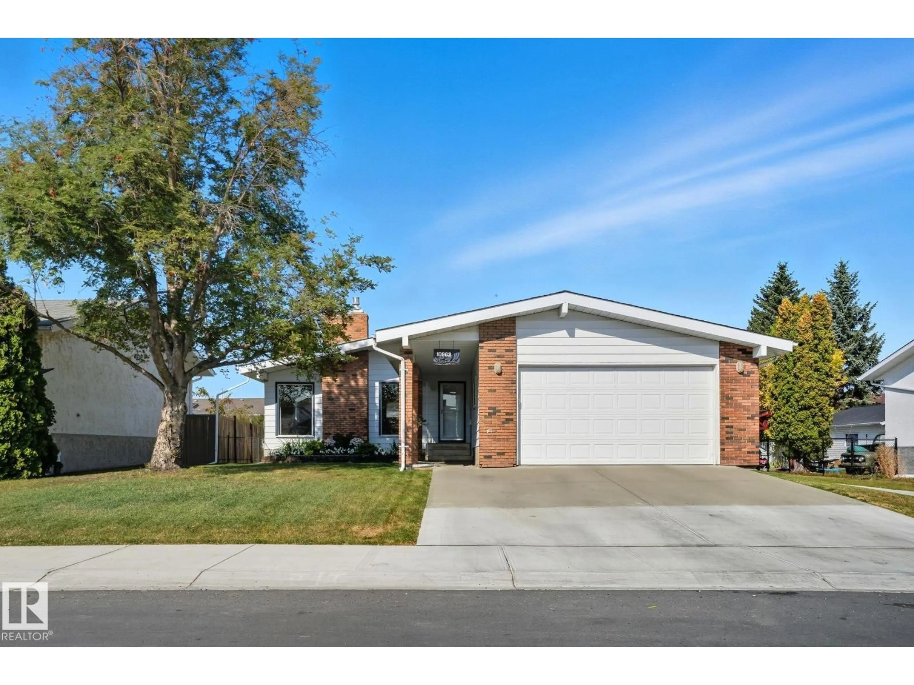 Home with brick exterior material, street for NW - 10962 168A AV, Edmonton Alberta T5X2N3