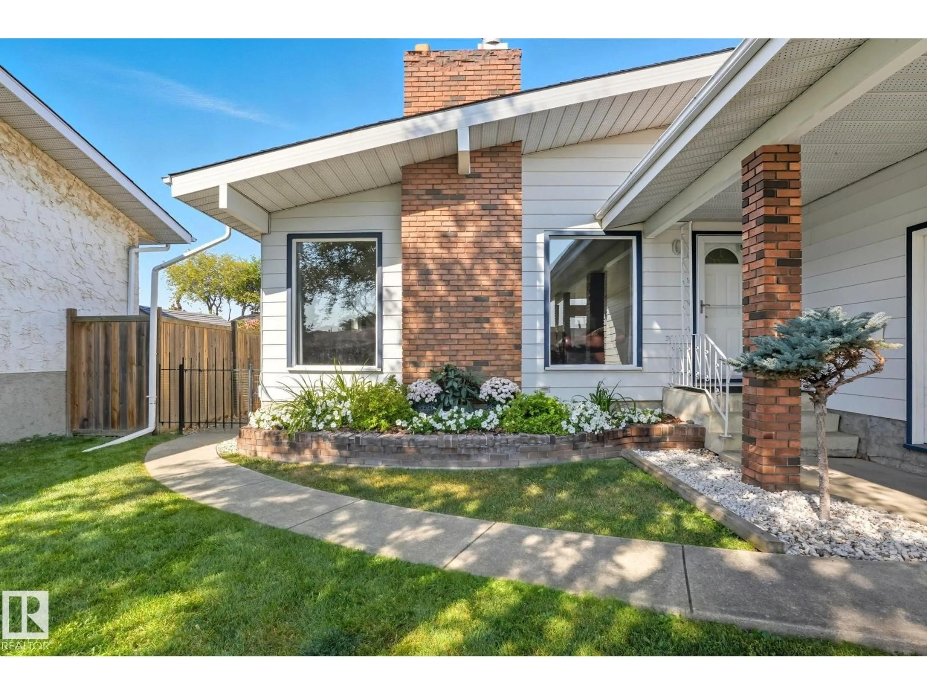Home with brick exterior material, street for NW - 10962 168A AV, Edmonton Alberta T5X2N3