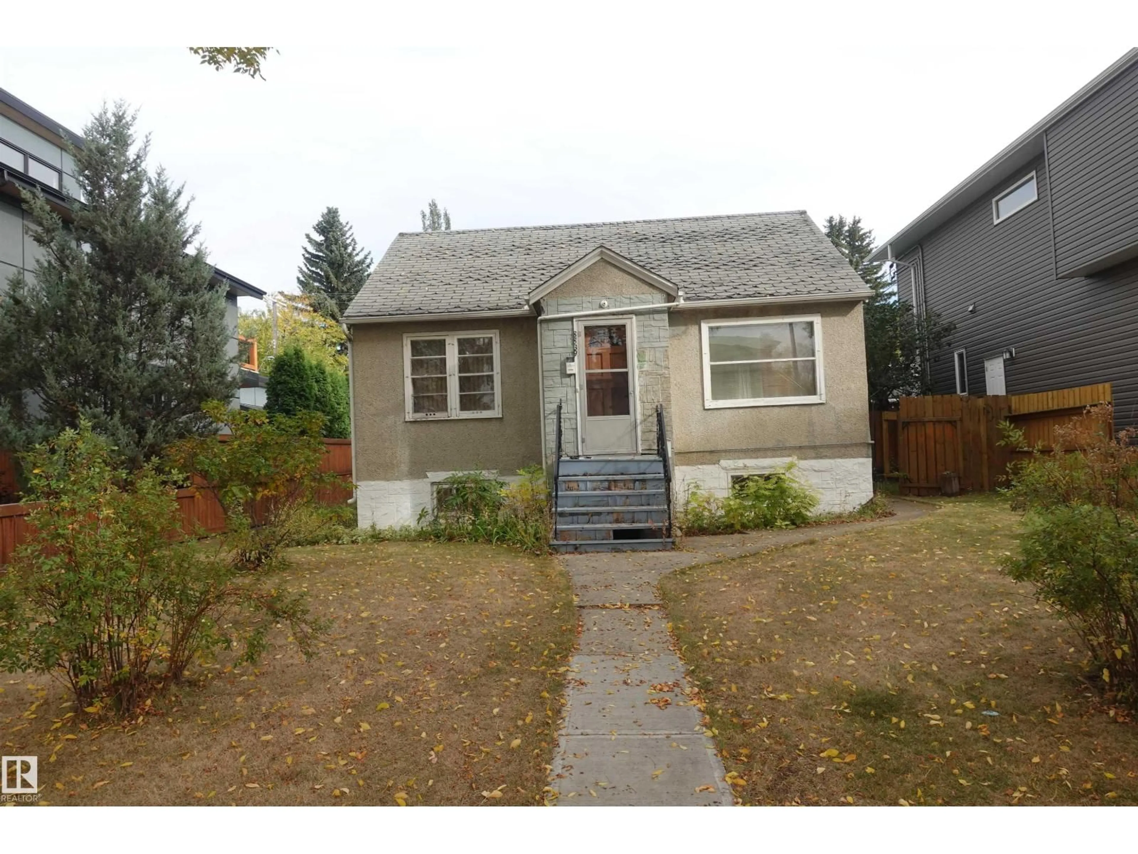 Home with vinyl exterior material, street for NW - 8839 90 ST, Edmonton Alberta T6C3L7