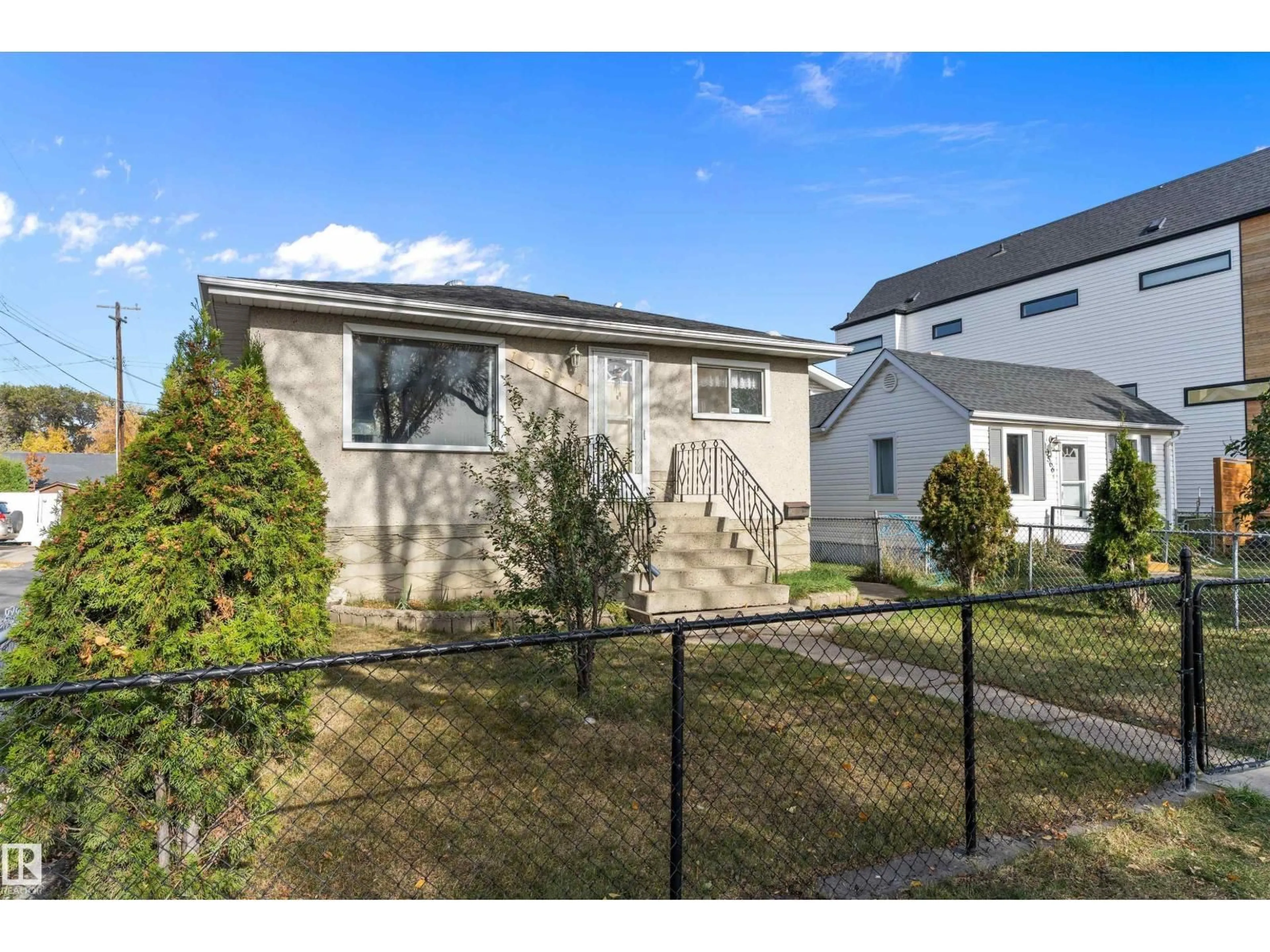 Home with vinyl exterior material, street for 10570 66 AV, Edmonton Alberta T6H1X4