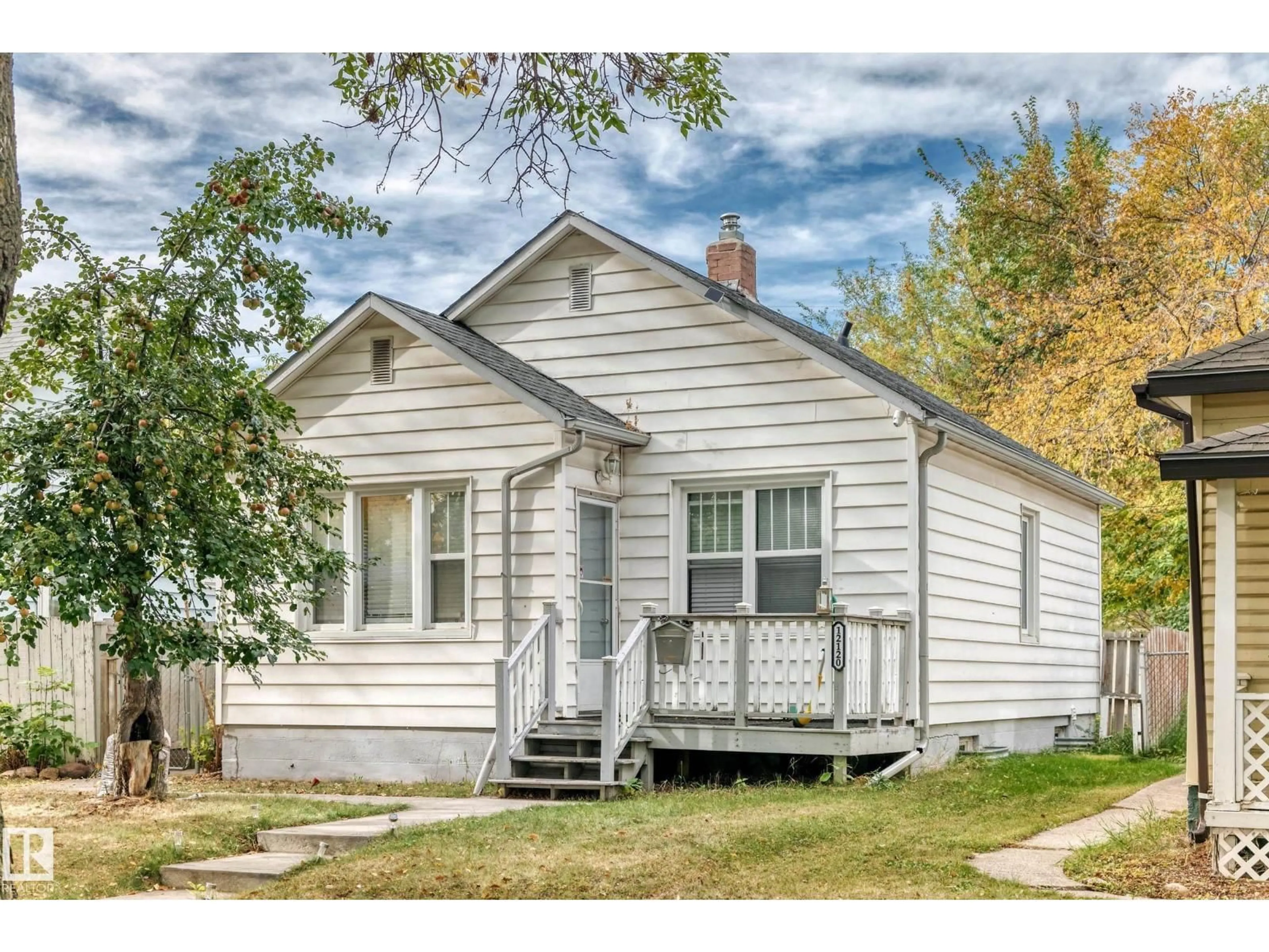 Home with vinyl exterior material, street for NW - 12120 64 ST, Edmonton Alberta T5W4J5