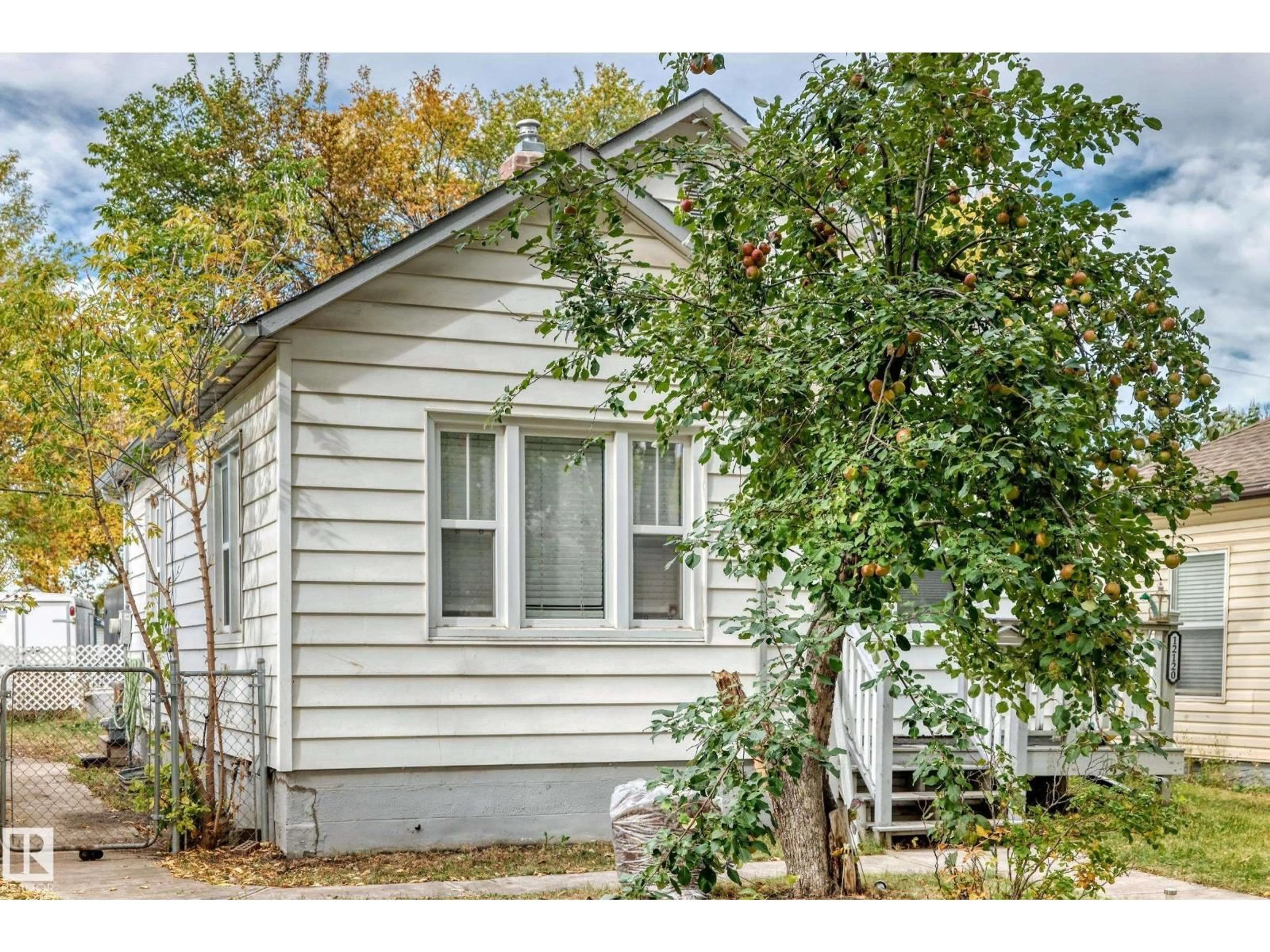 Home with vinyl exterior material, street for NW - 12120 64 ST, Edmonton Alberta T5W4J5