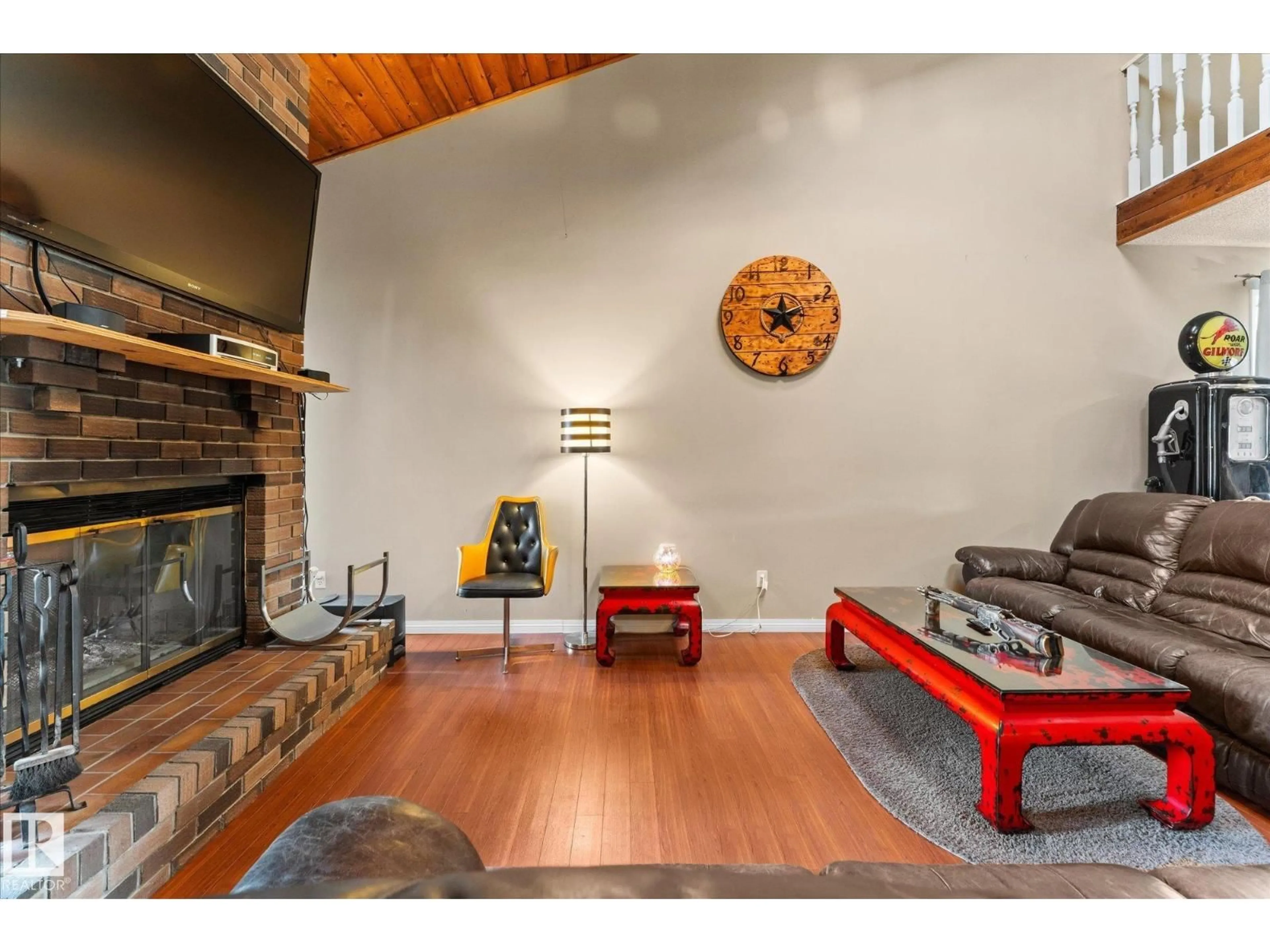 Living room with furniture, wood/laminate floor for 11907 164 AV, Edmonton Alberta T5X5C1