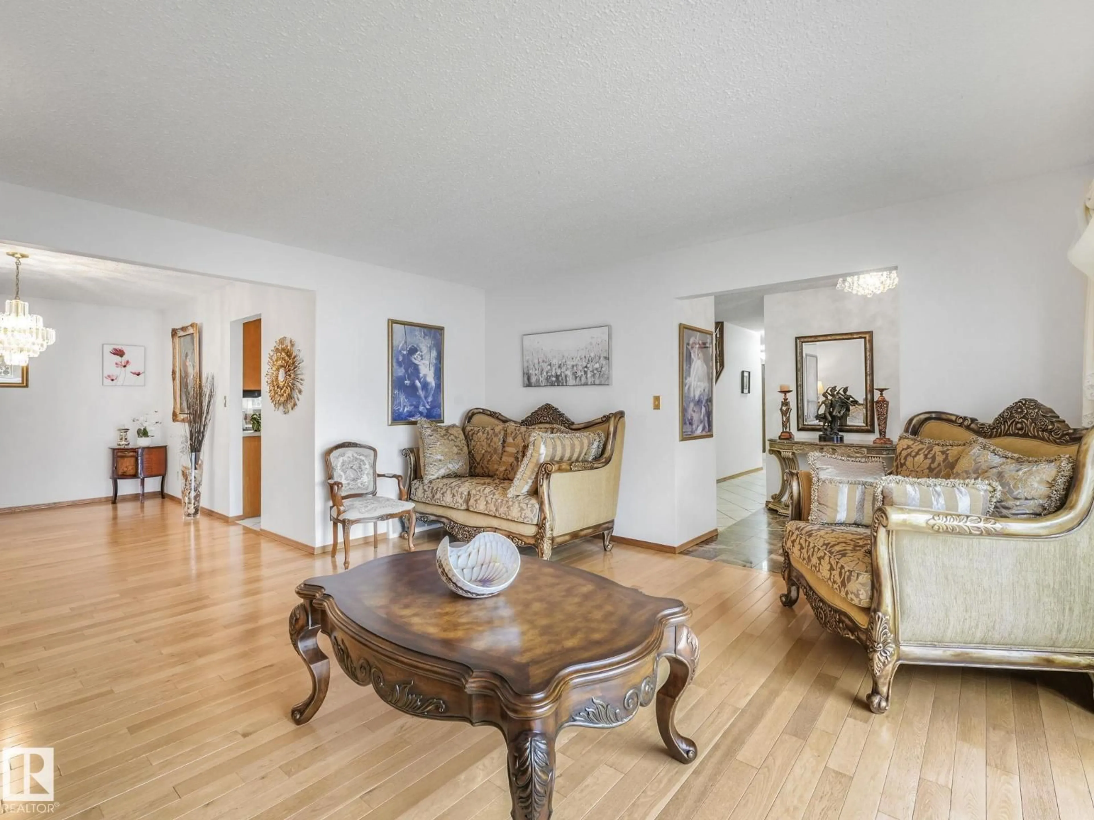 Living room with furniture, wood/laminate floor for 11106 173A AV, Edmonton Alberta T5X3J9