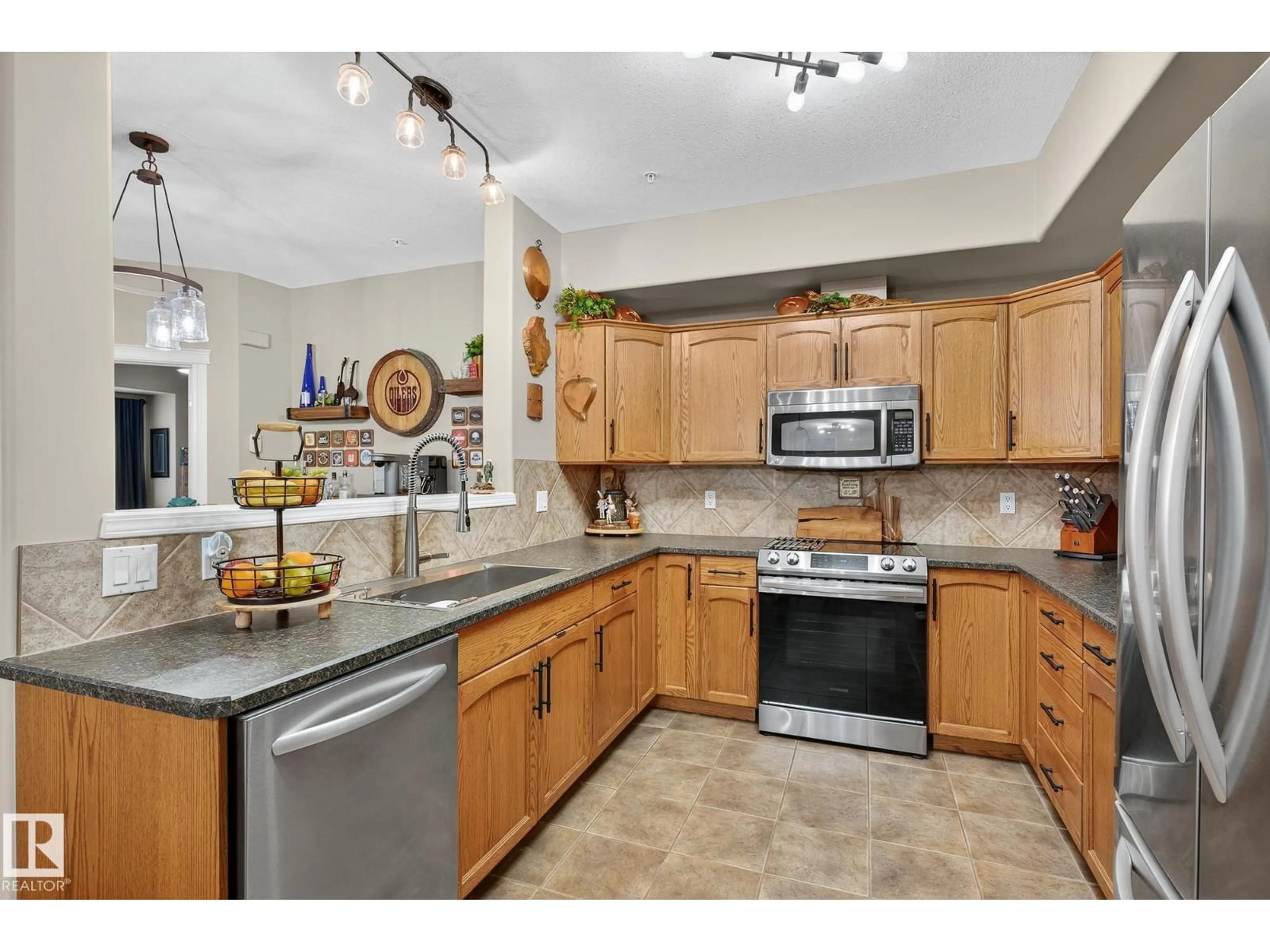 Open concept kitchen, ceramic/tile floor for #107 - 45 INGLEWOOD DR, St. Albert Alberta T8N0B6