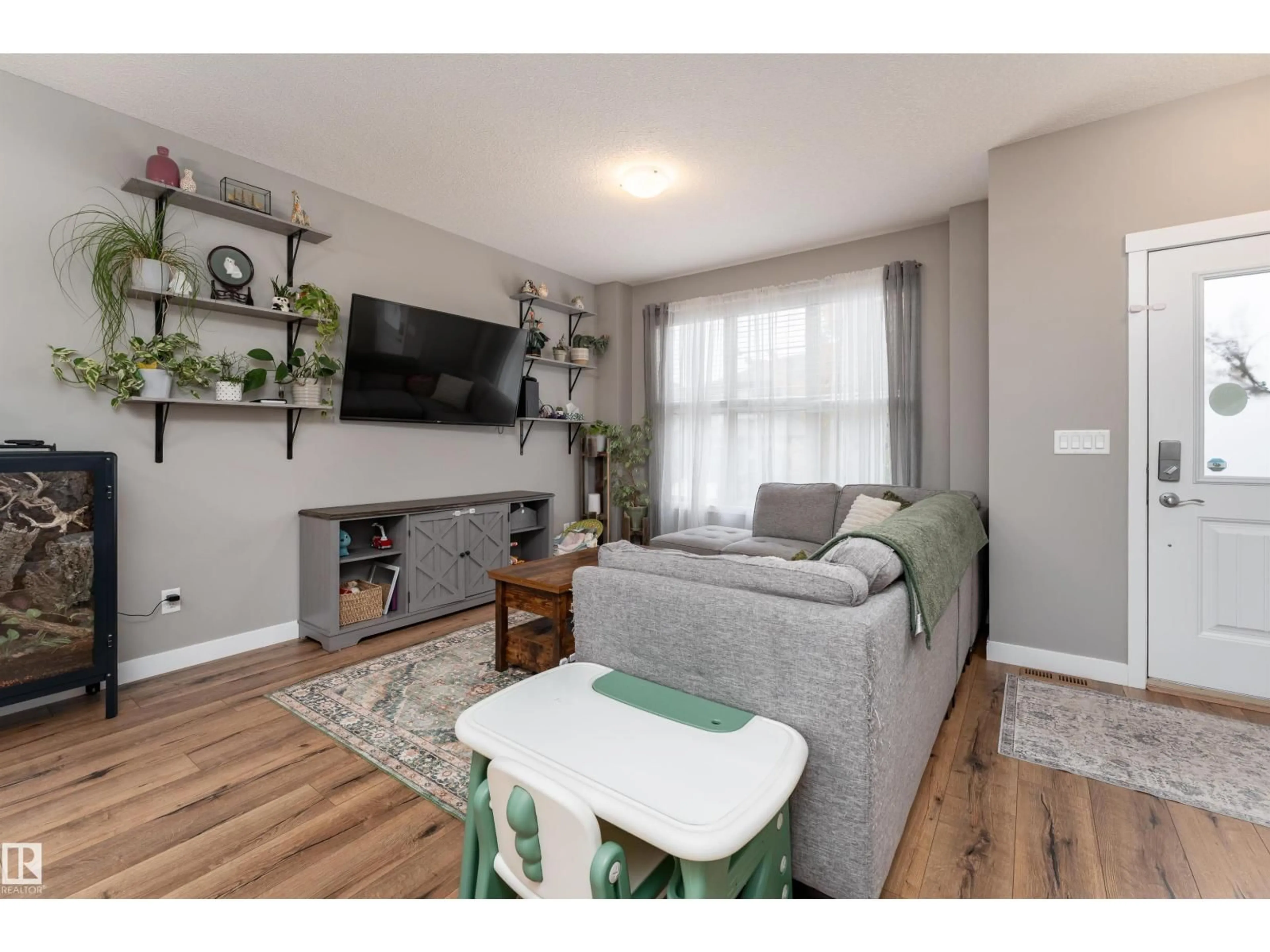 Living room with furniture, wood/laminate floor for 32 GREENBURY CL, Spruce Grove Alberta T7X0A7