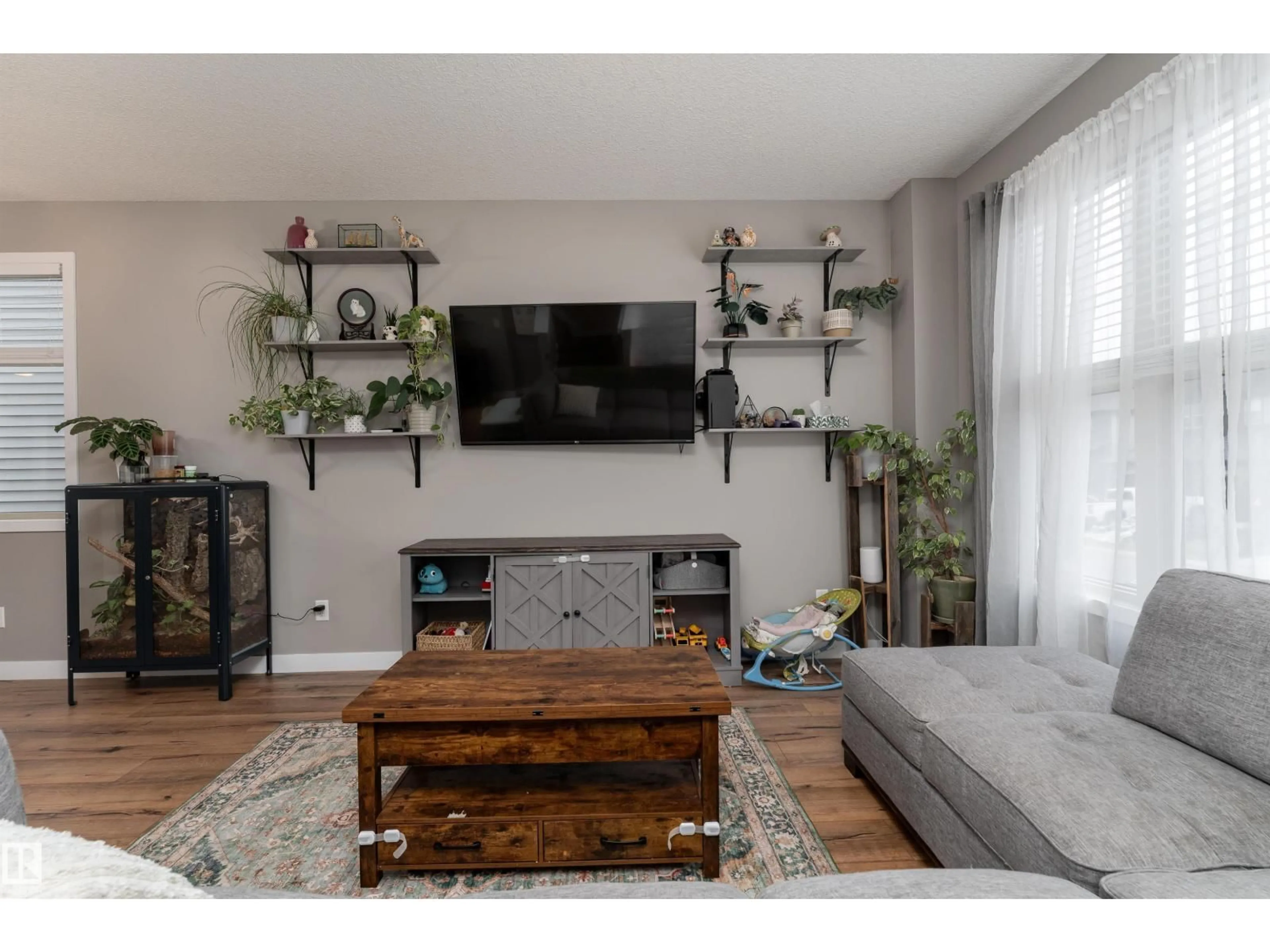 Living room with furniture, wood/laminate floor for 32 GREENBURY CL, Spruce Grove Alberta T7X0A7