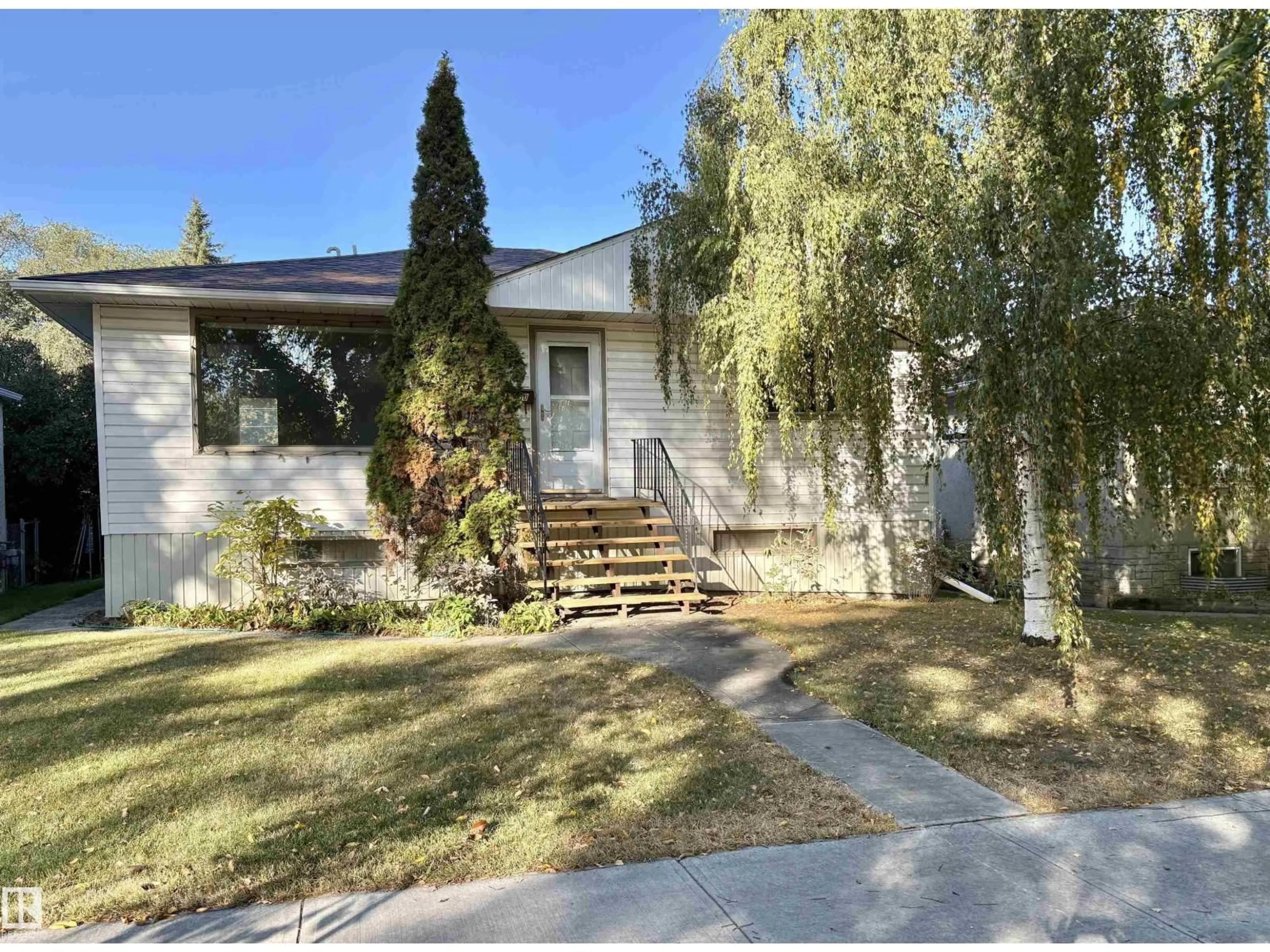 Home with vinyl exterior material, street for 12050 56 ST, Edmonton Alberta T5W3T1