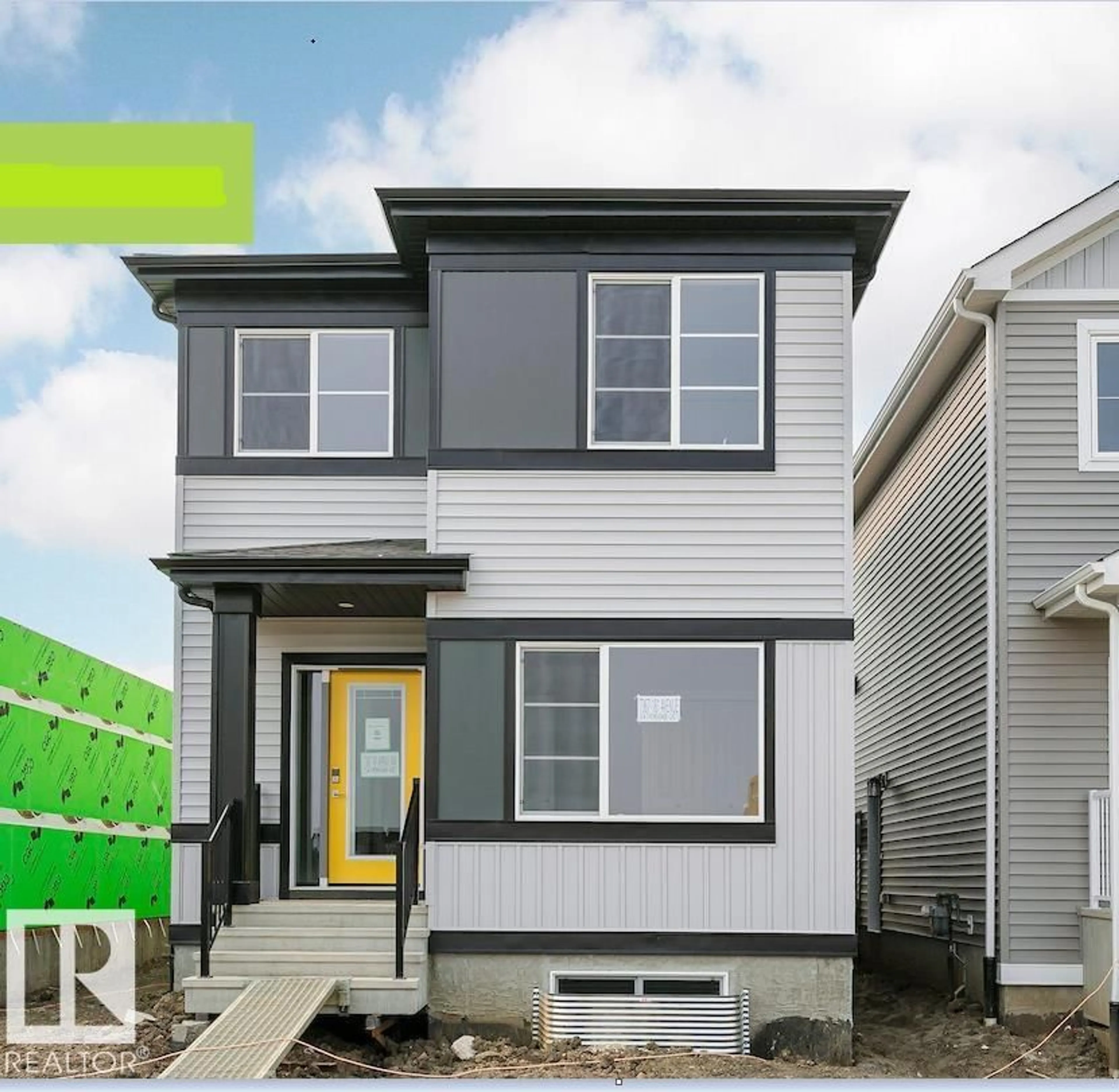 Home with vinyl exterior material, street for 7355 181 AV, Edmonton Alberta T5Z0J1