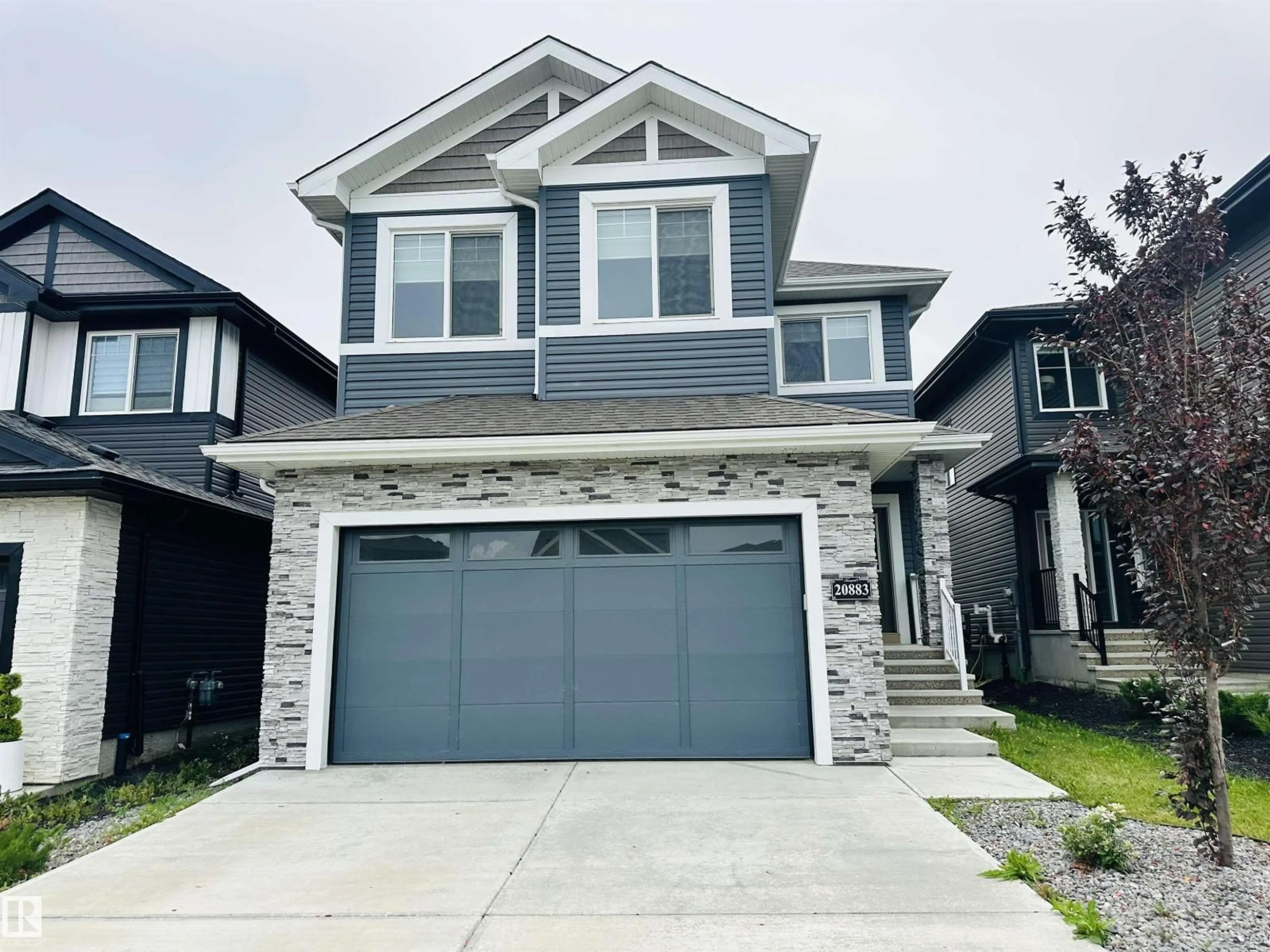 Home with vinyl exterior material, street for 20883 131 AV, Edmonton Alberta T5S0P1