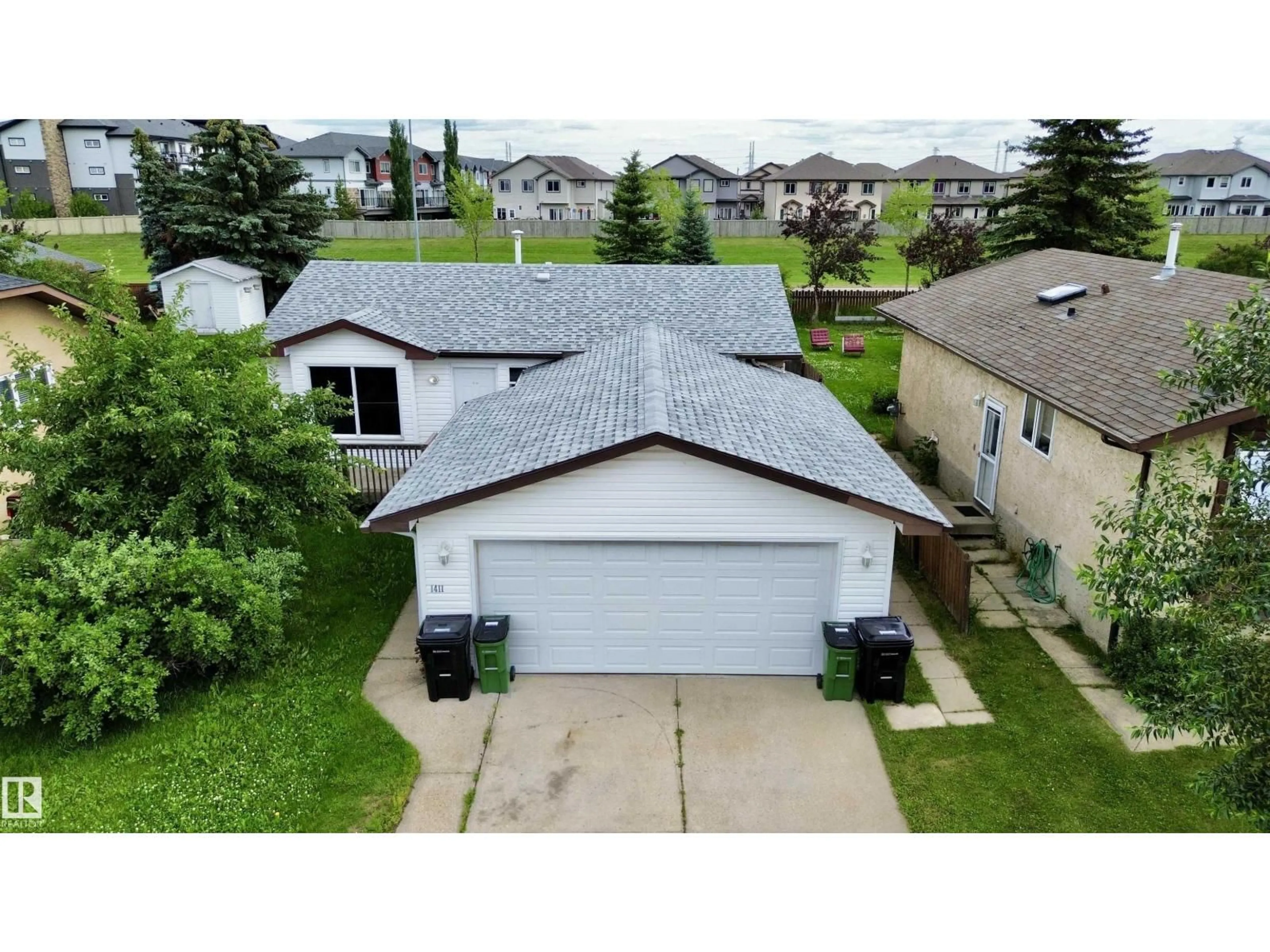 A pic from outside/outdoor area/front of a property/back of a property/a pic from drone, street for 1411 35 ST, Edmonton Alberta T6L2M2