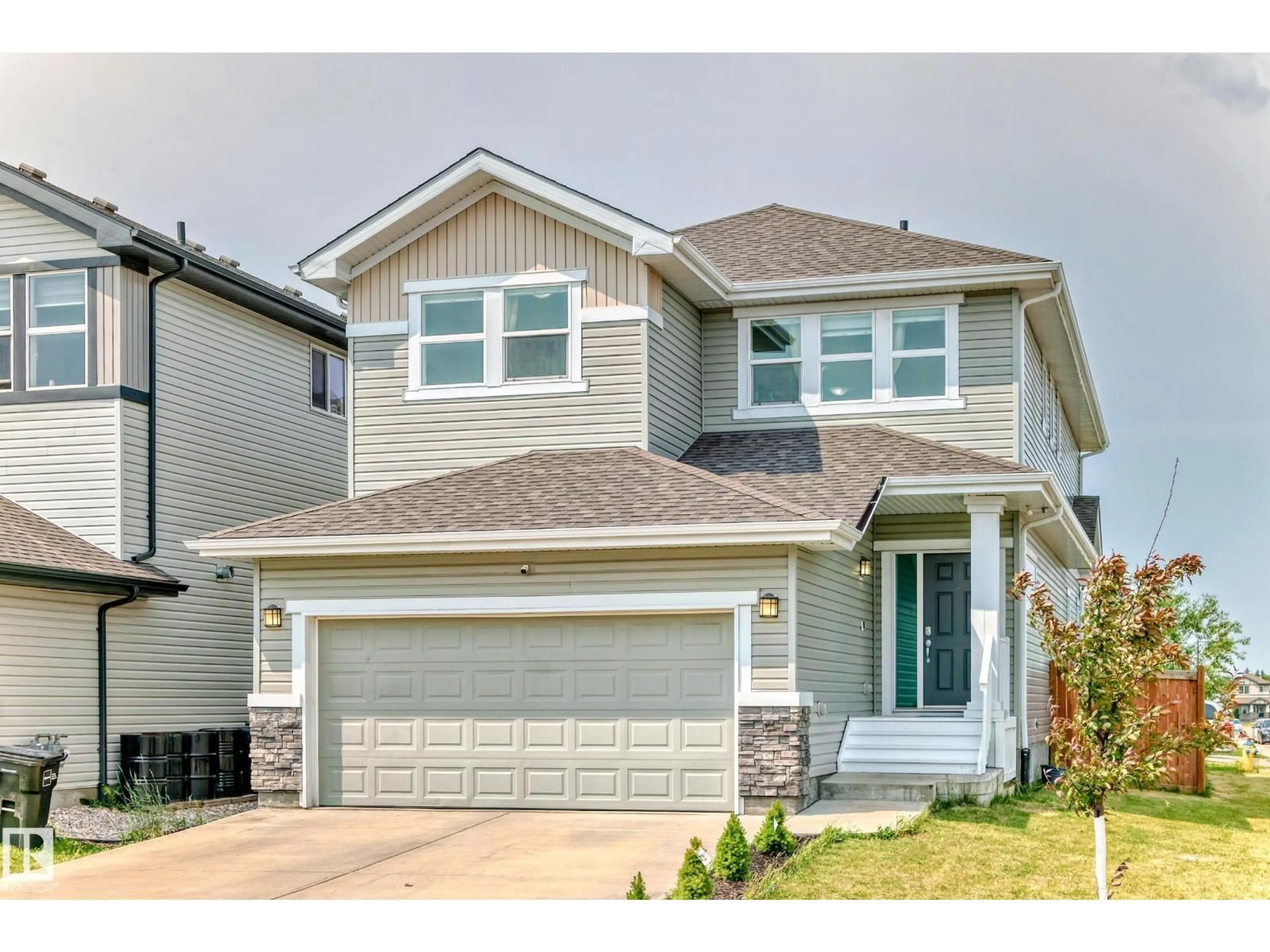 Home with vinyl exterior material, street for 1452 30 ST, Edmonton Alberta T6T0Z5