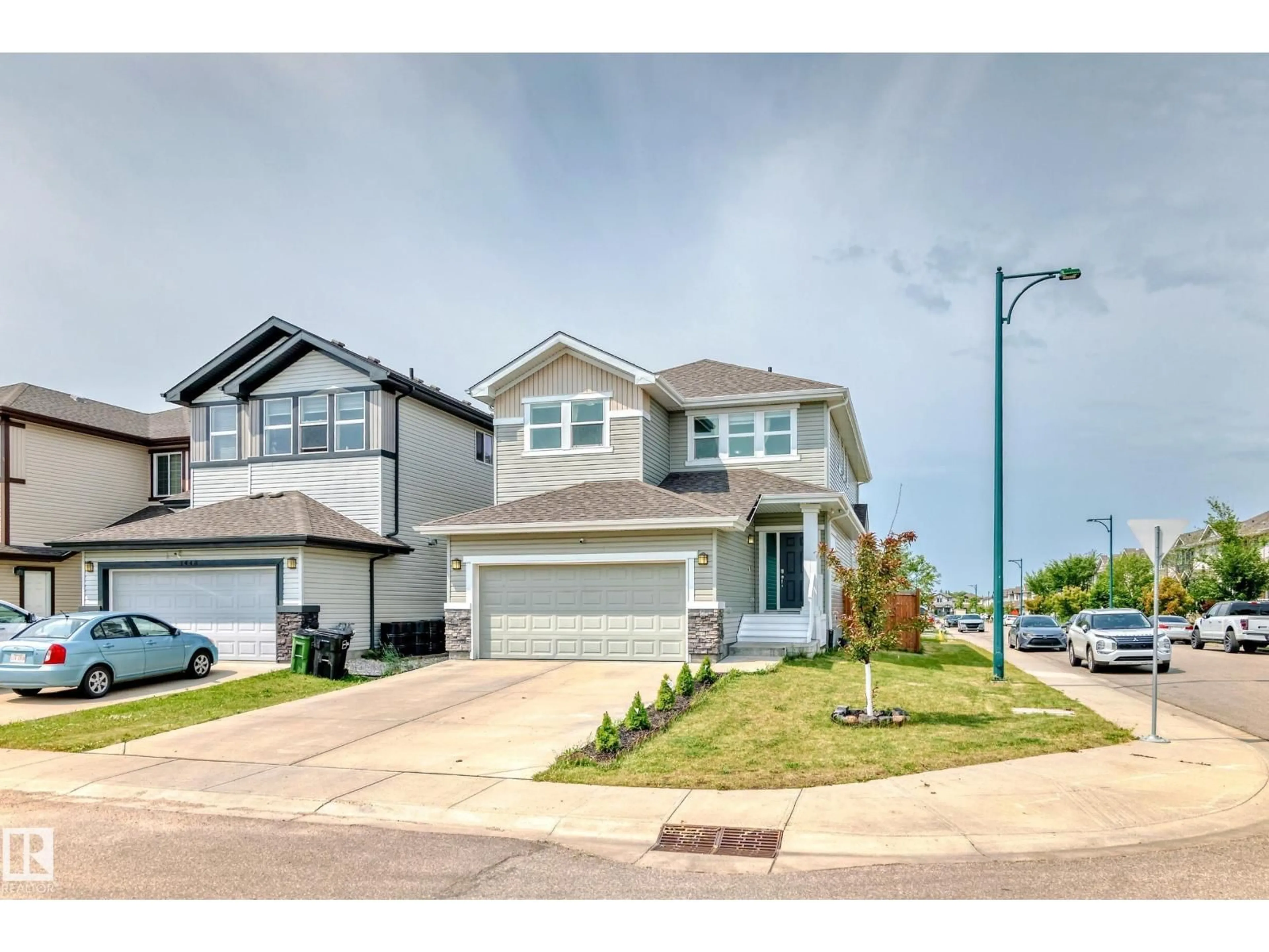 Home with vinyl exterior material, street for 1452 30 ST, Edmonton Alberta T6T0Z5