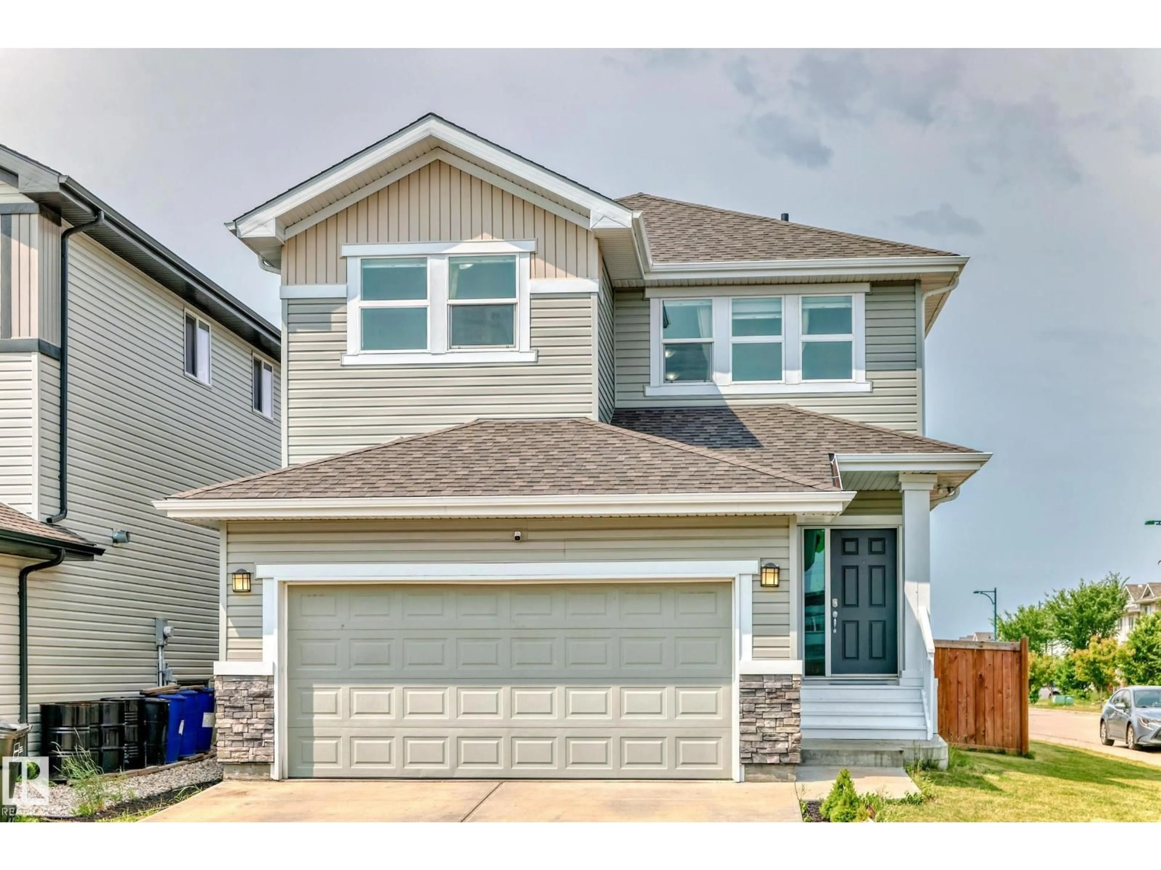 Home with vinyl exterior material, street for 1452 30 ST, Edmonton Alberta T6T0Z5