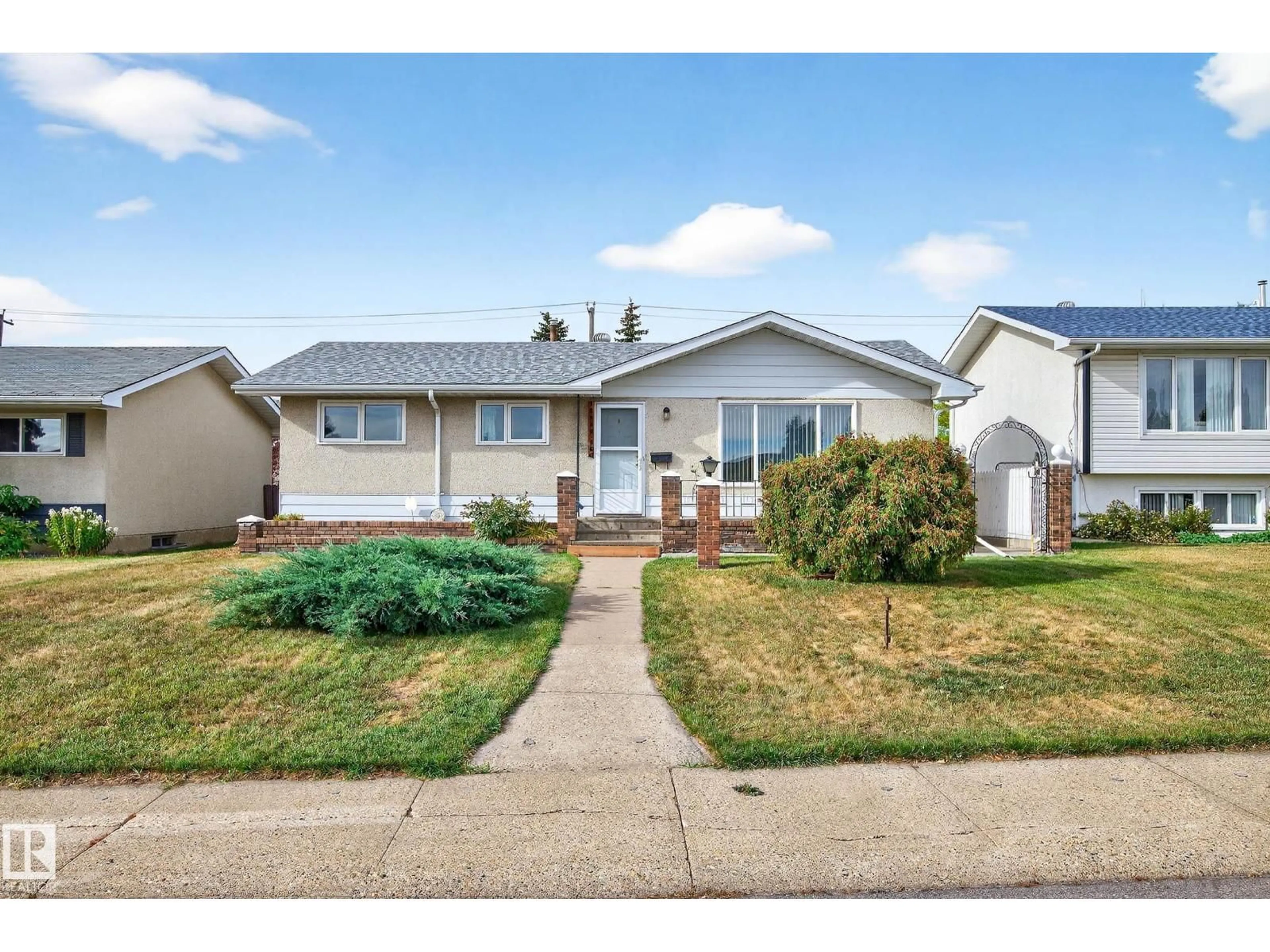 Home with vinyl exterior material, street for NW - 15008 96 ST, Edmonton Alberta T5E4W7