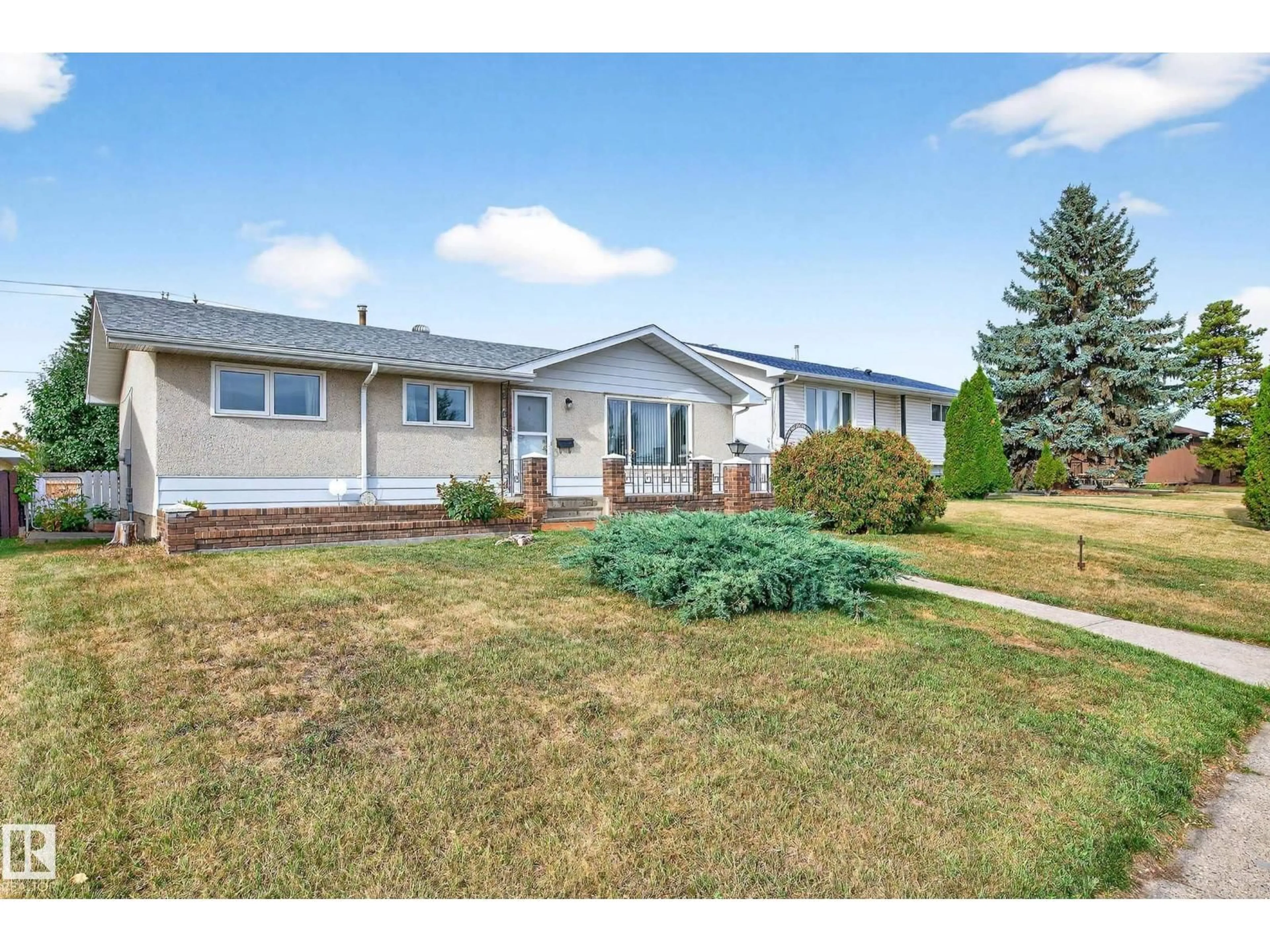 Home with vinyl exterior material, street for NW - 15008 96 ST, Edmonton Alberta T5E4W7