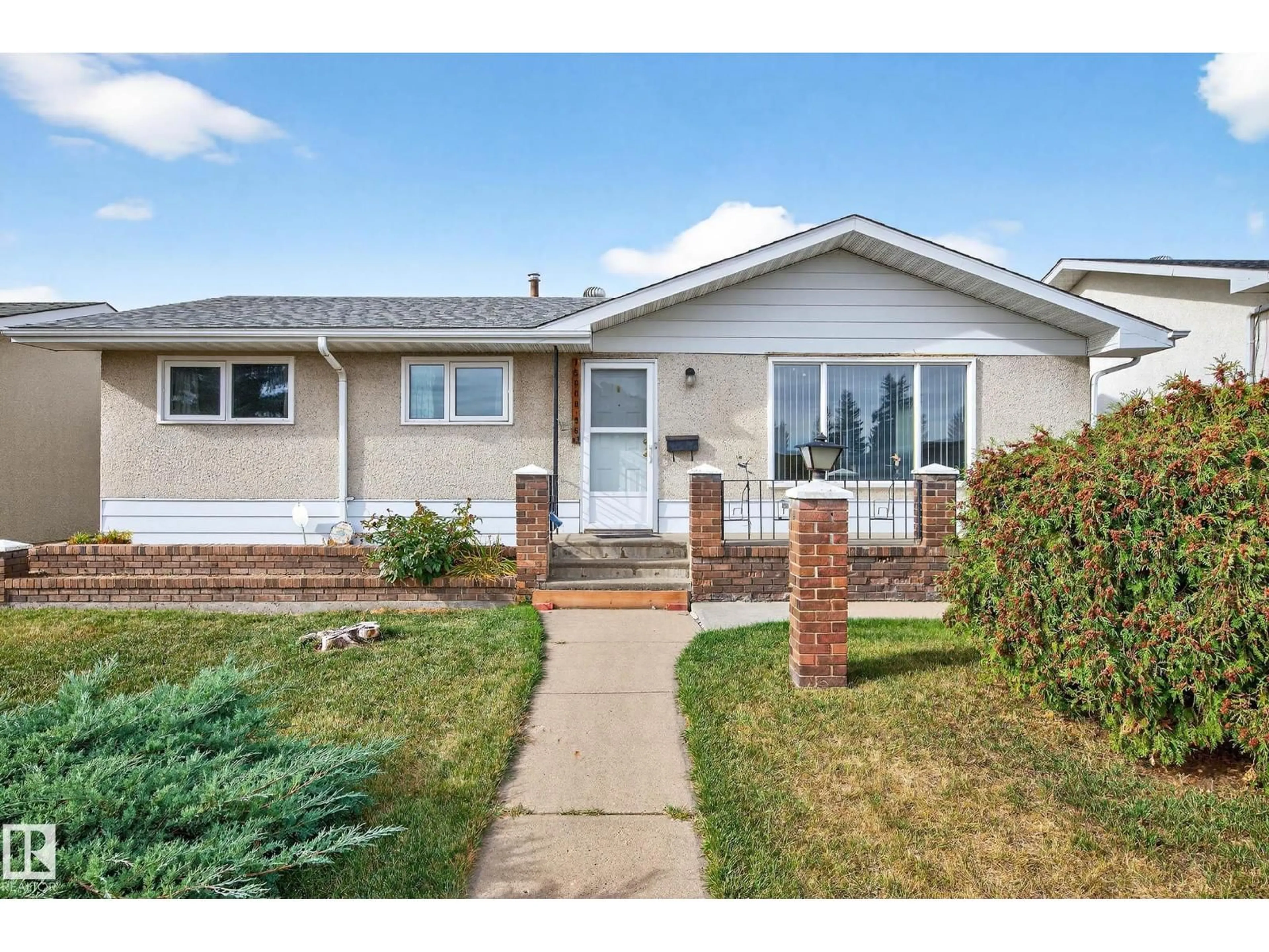 Home with vinyl exterior material, street for NW - 15008 96 ST, Edmonton Alberta T5E4W7