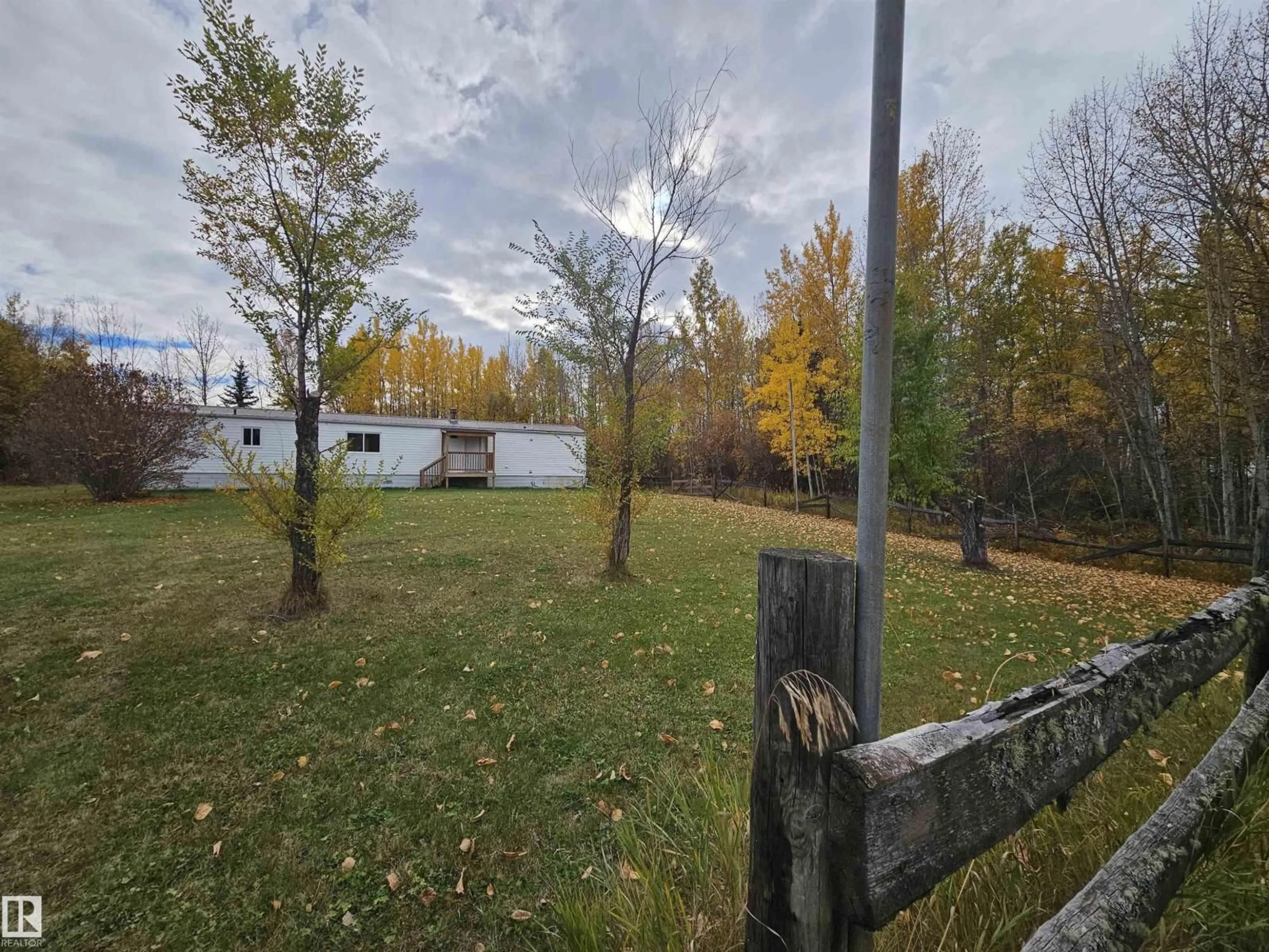 A pic from outside/outdoor area/front of a property/back of a property/a pic from drone, forest/trees view for #46 - 54222 RGE ROAD 25, Rural Lac Ste. Anne County Alberta T0E1V0
