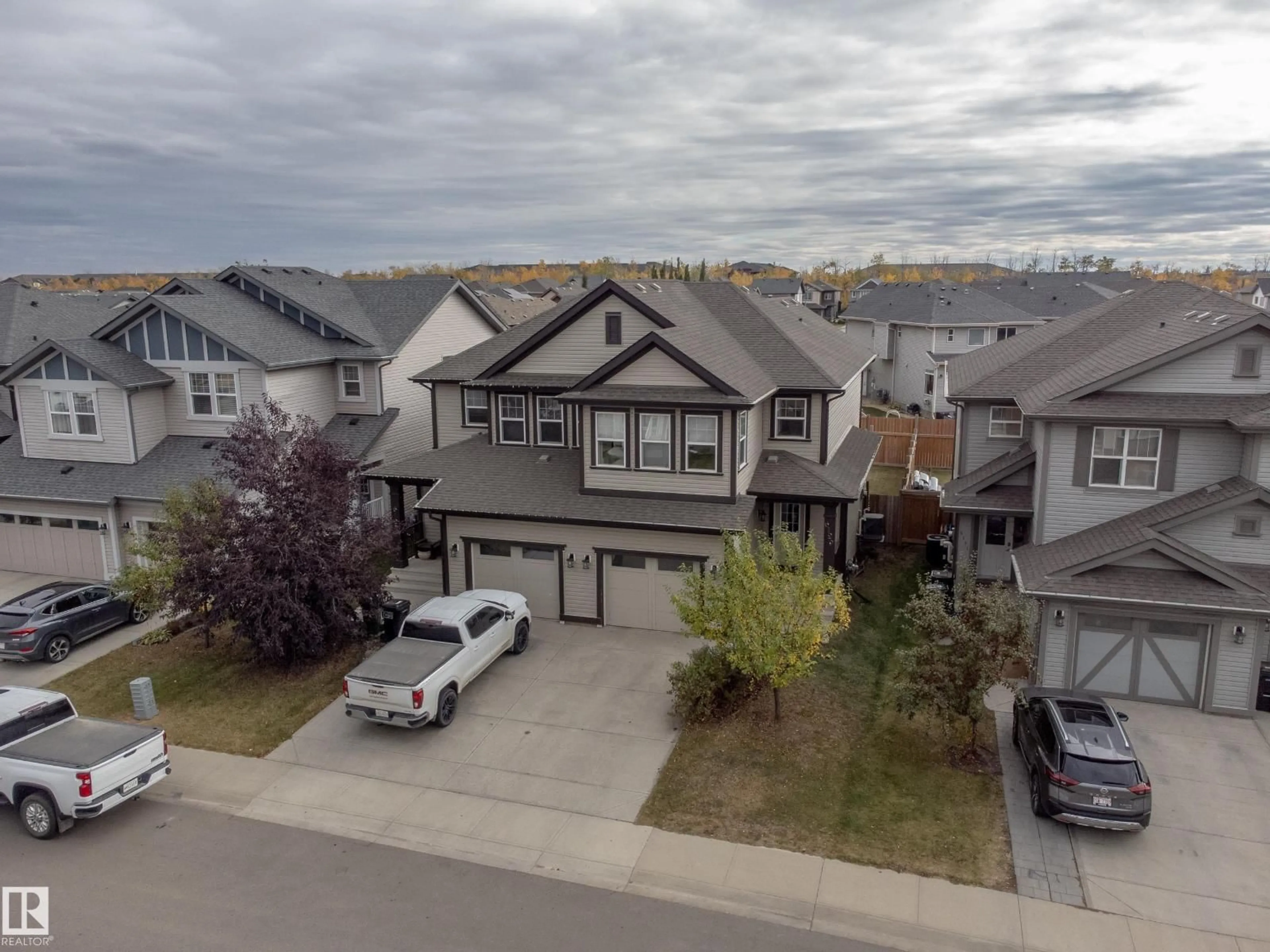 A pic from outside/outdoor area/front of a property/back of a property/a pic from drone, street for 6129 176 AV, Edmonton Alberta T5Y3P1