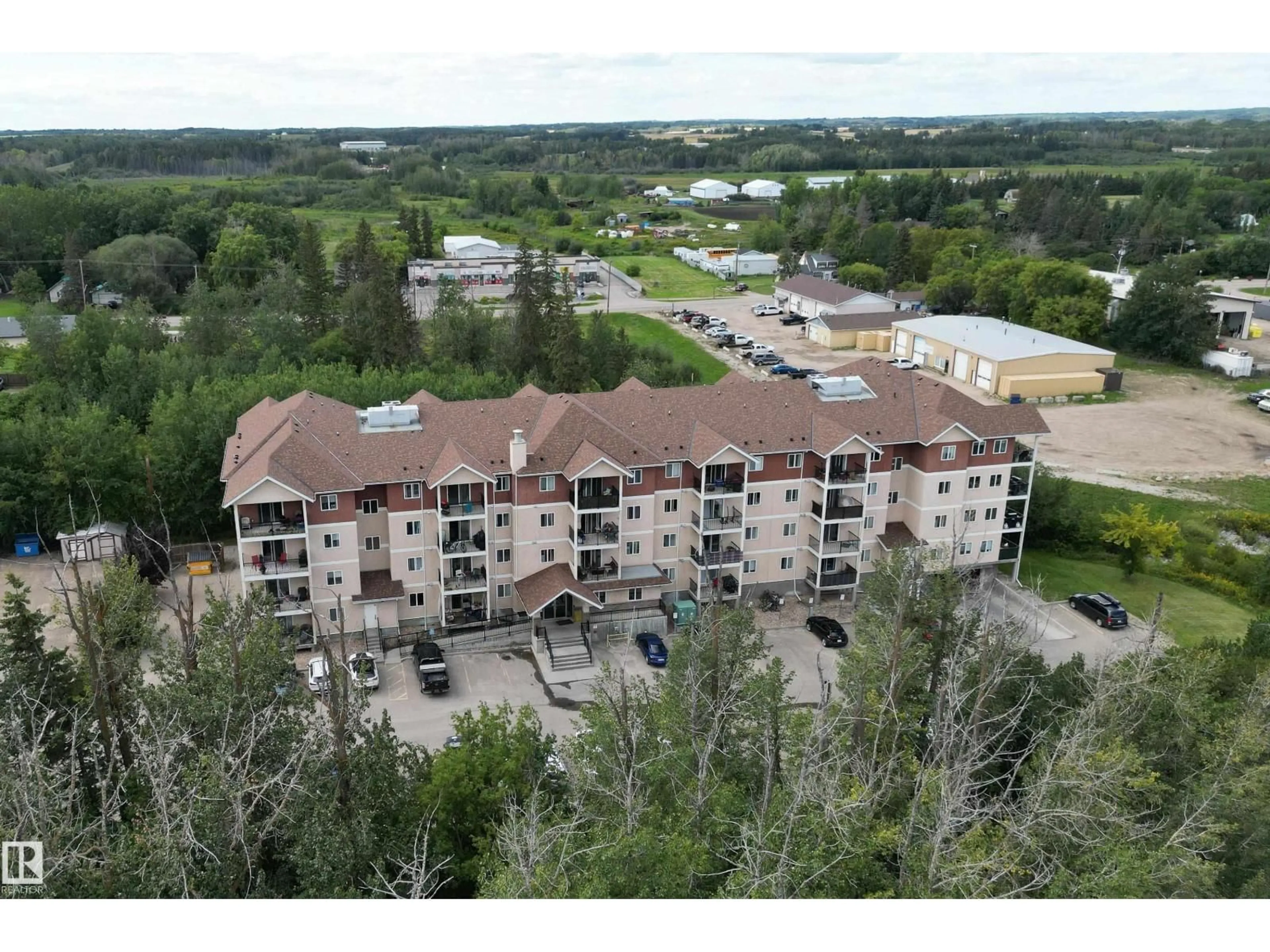 A pic from outside/outdoor area/front of a property/back of a property/a pic from drone, building for #401 - 4903 47 AV, Stony Plain Alberta T7Z0C6