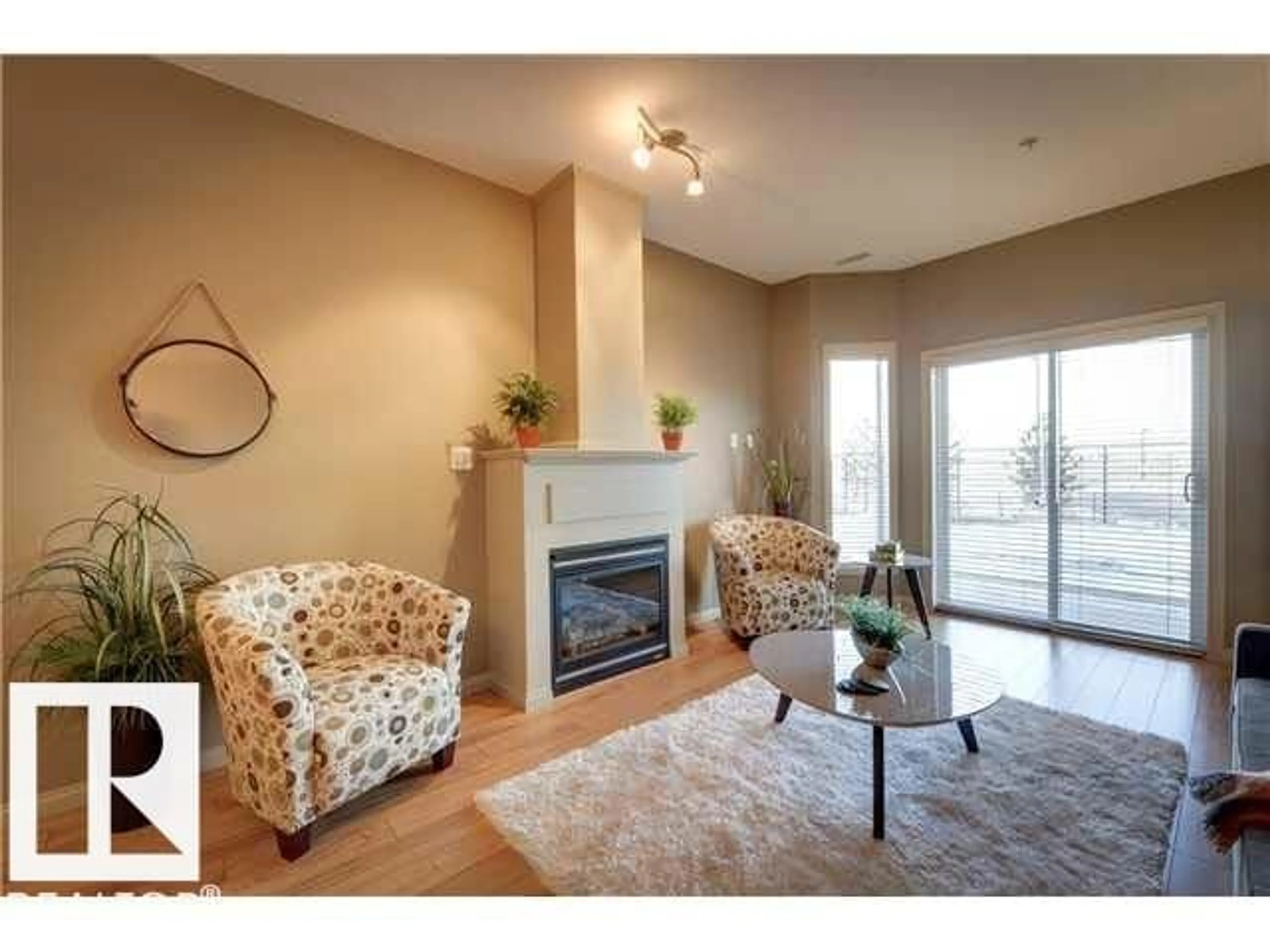 Living room with furniture, wood/laminate floor for #112 - 4312 139 AV, Edmonton Alberta T5Y3J4