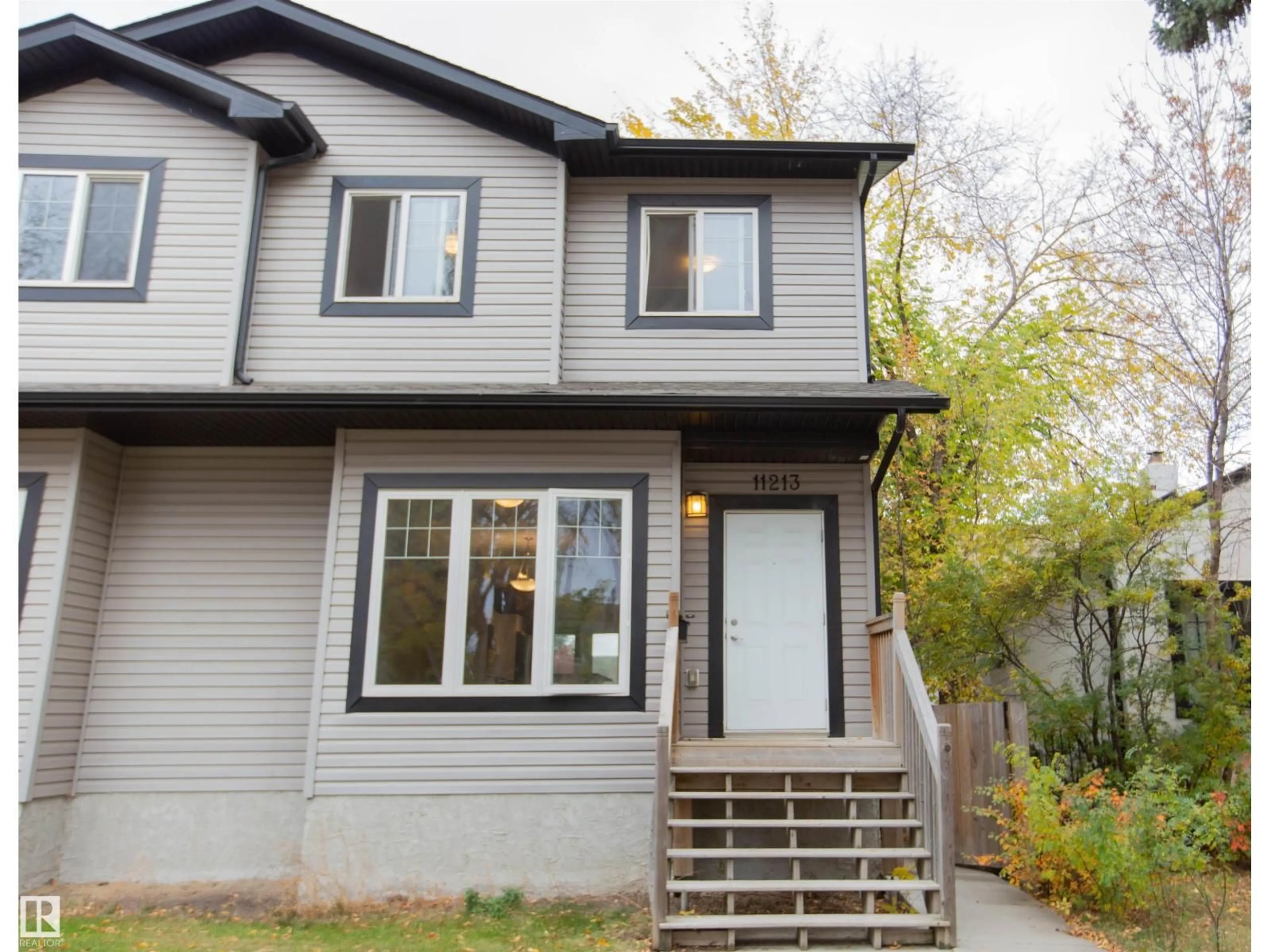Home with vinyl exterior material, street for NW - 11213 125 ST, Edmonton Alberta T5L4G6