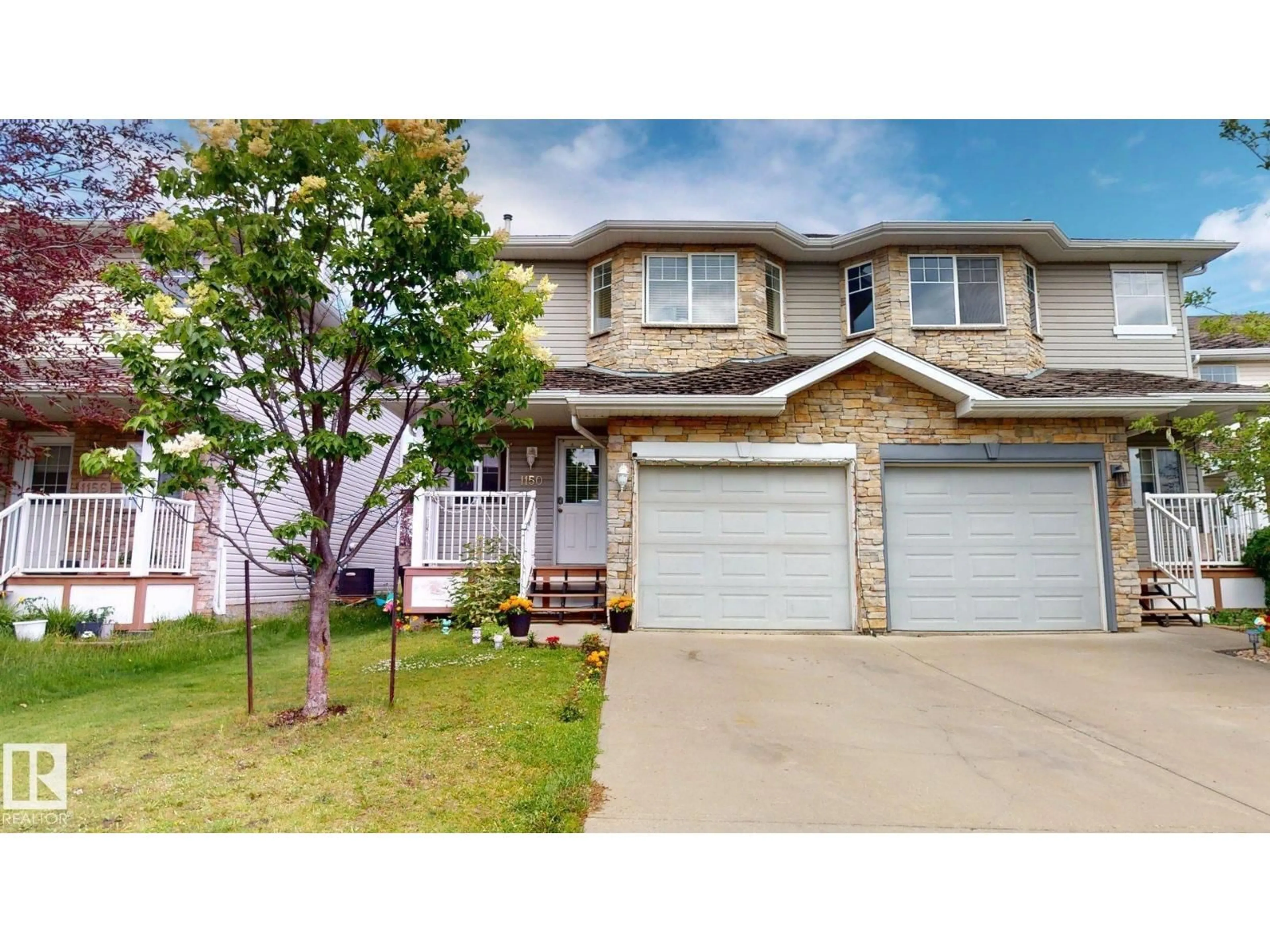 Home with vinyl exterior material, street for NW - 1150 37B AVE, Edmonton Alberta T6T0E6