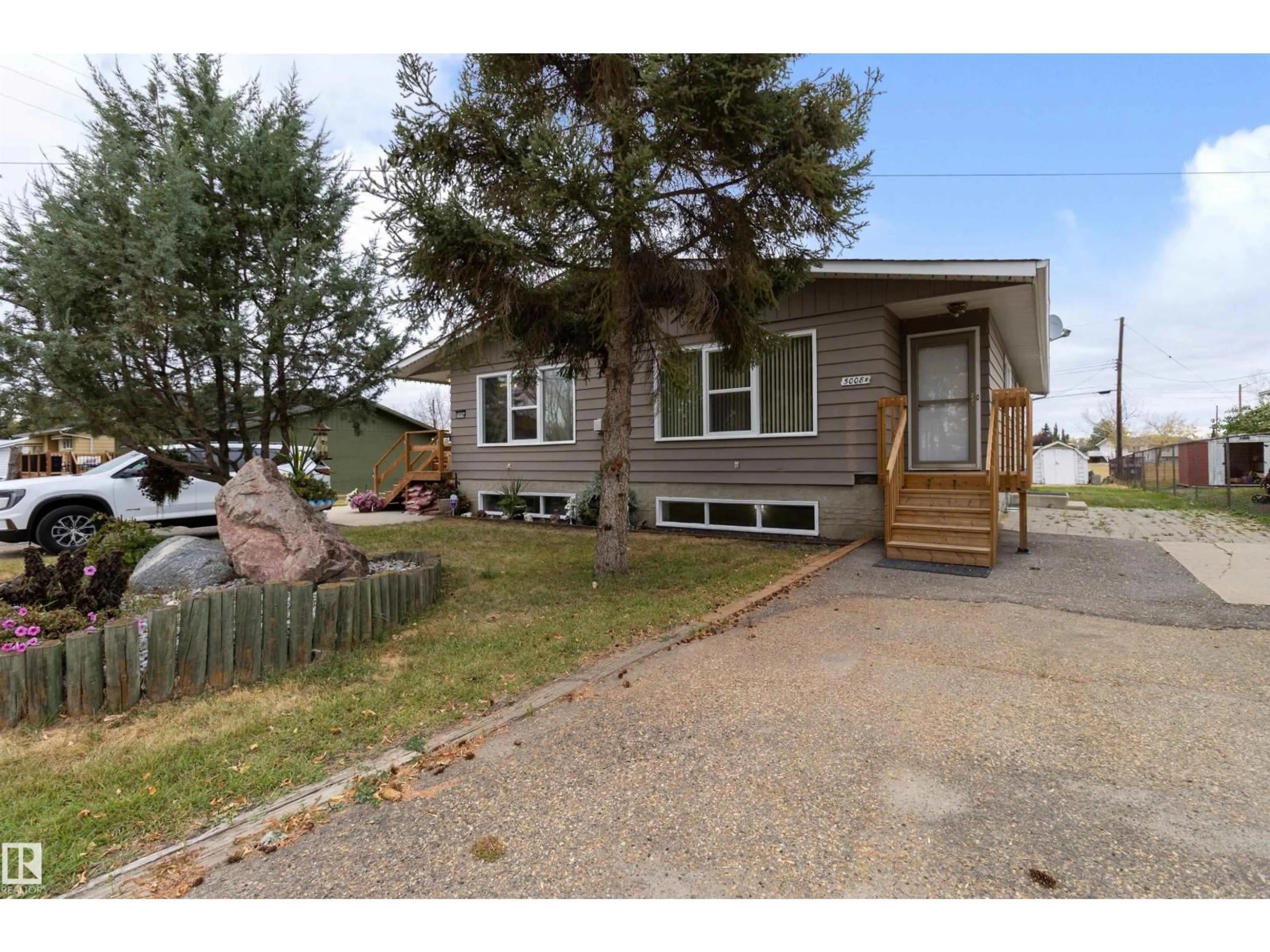 Home with vinyl exterior material, street for 5008 56 AVE, Tofield Alberta T0B4J0