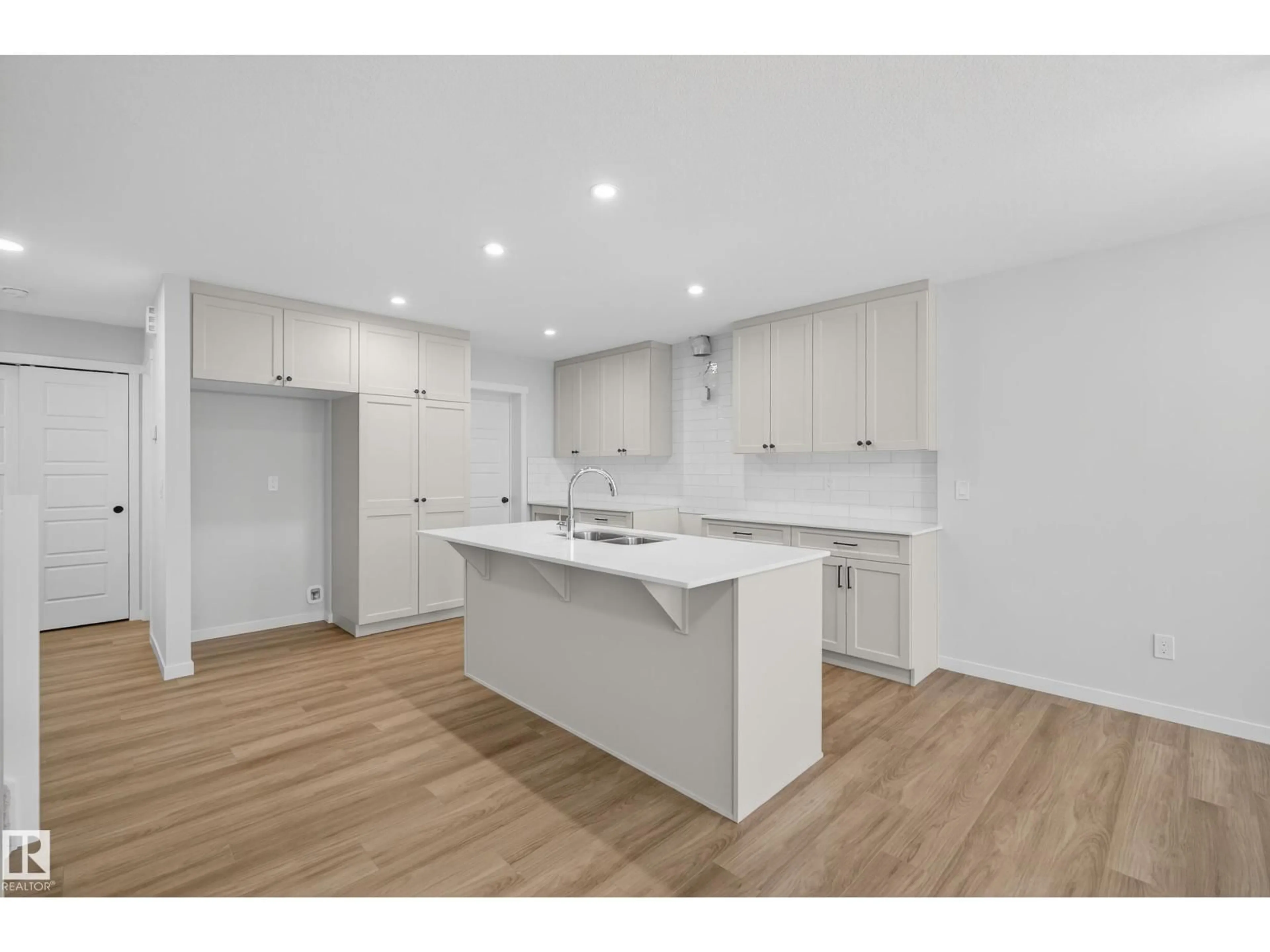Open concept kitchen, wood/laminate floor for 89 ROSEWOOD WY, St. Albert Alberta T8N8B3