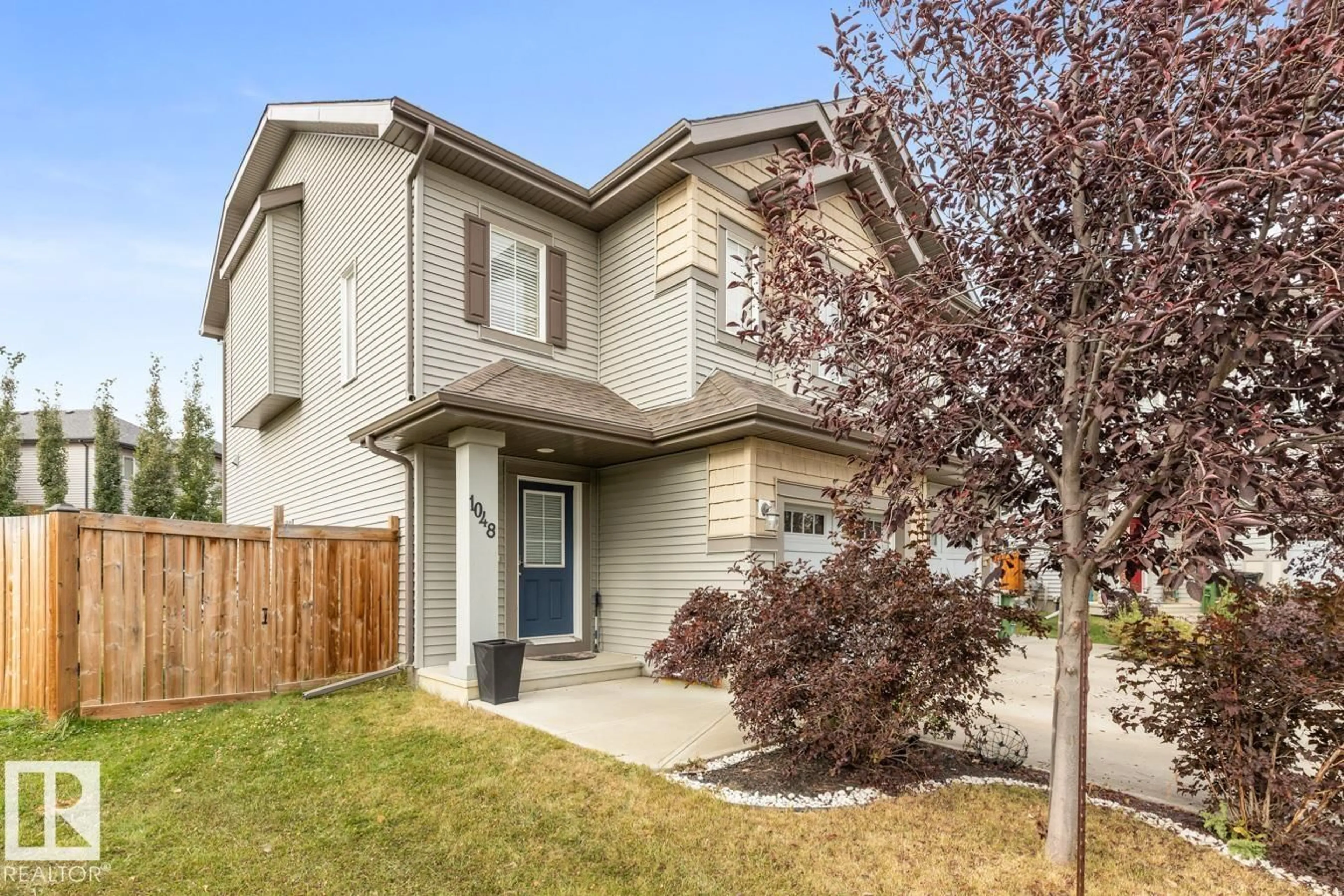 Home with vinyl exterior material, street for 1048 EAST BN NW, Edmonton Alberta T6M0V6