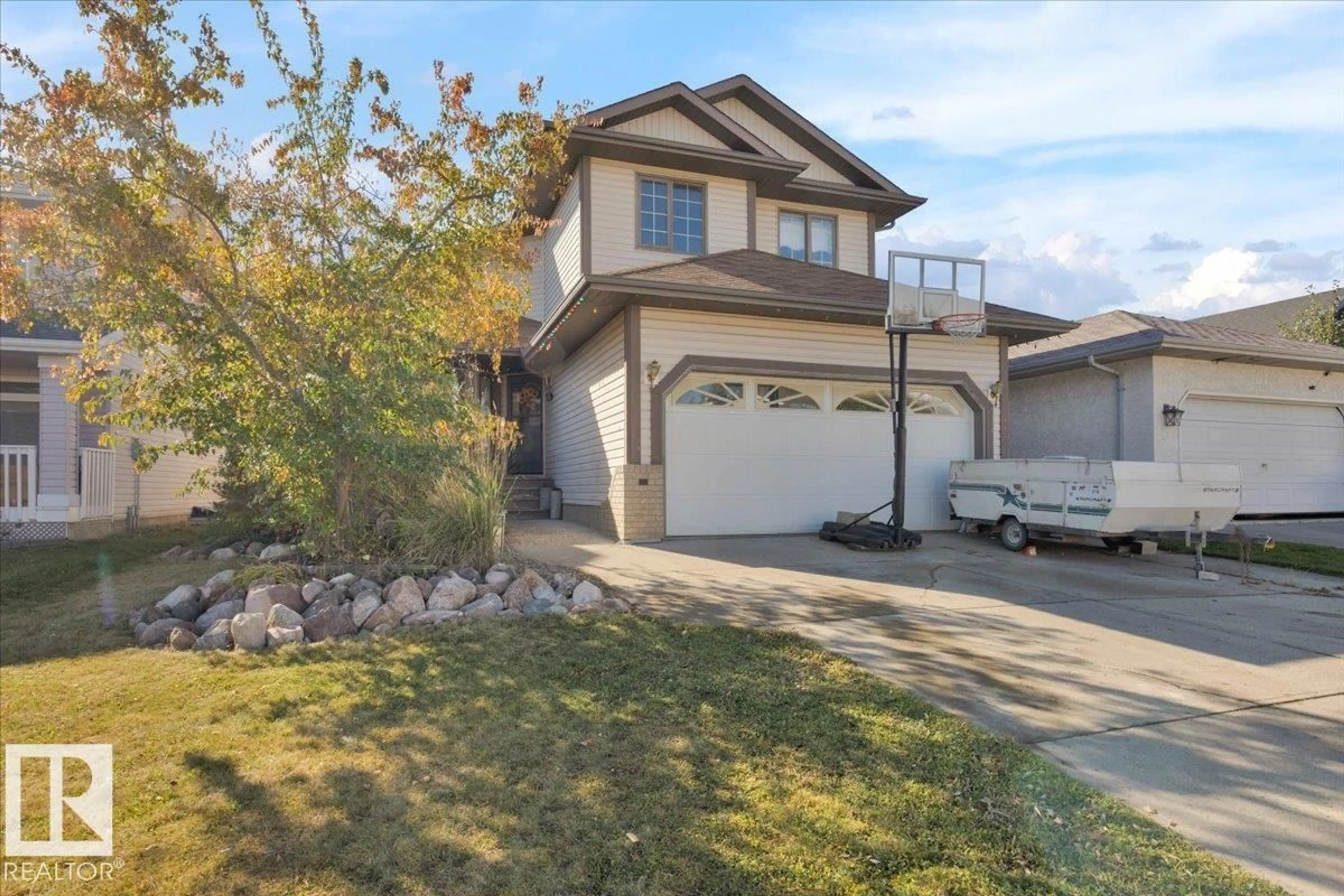 Home with vinyl exterior material, street for 6107 159 AV, Edmonton Alberta T5Y2P4
