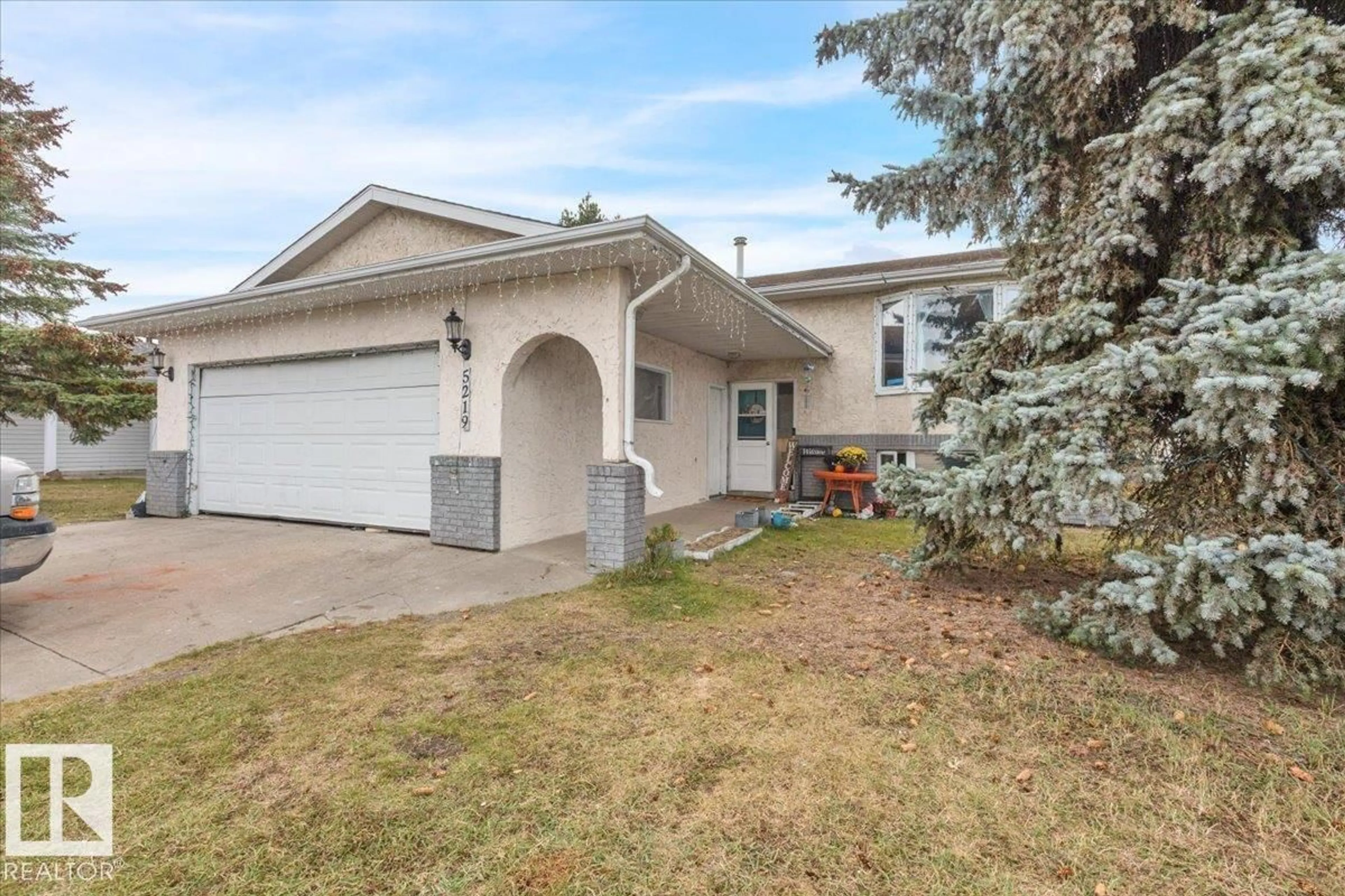 Home with vinyl exterior material, street for 5219 45 ST, Tofield Alberta T0B4J0