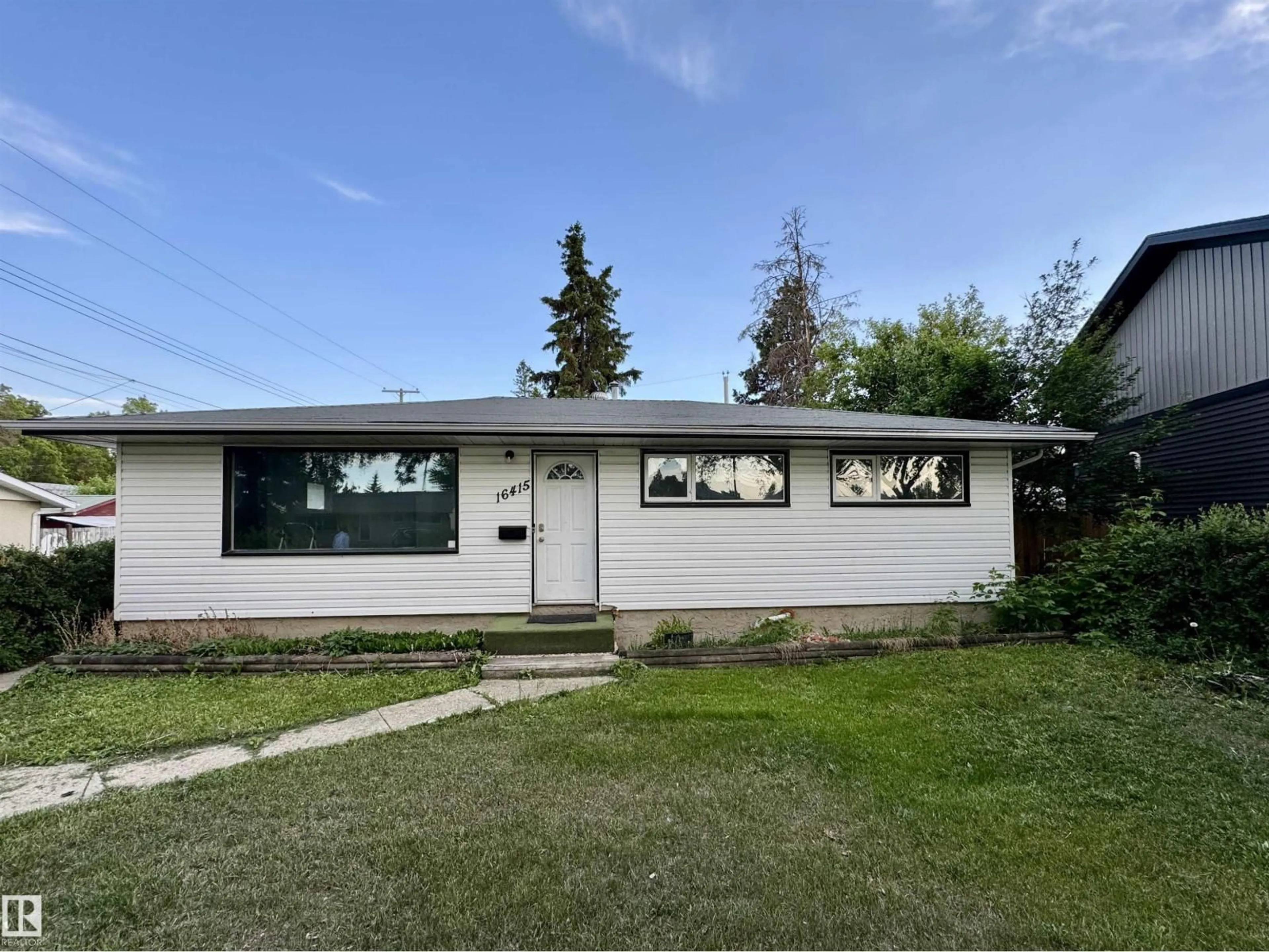 Home with vinyl exterior material, street for 16415 106 AV, Edmonton Alberta T5P0X1