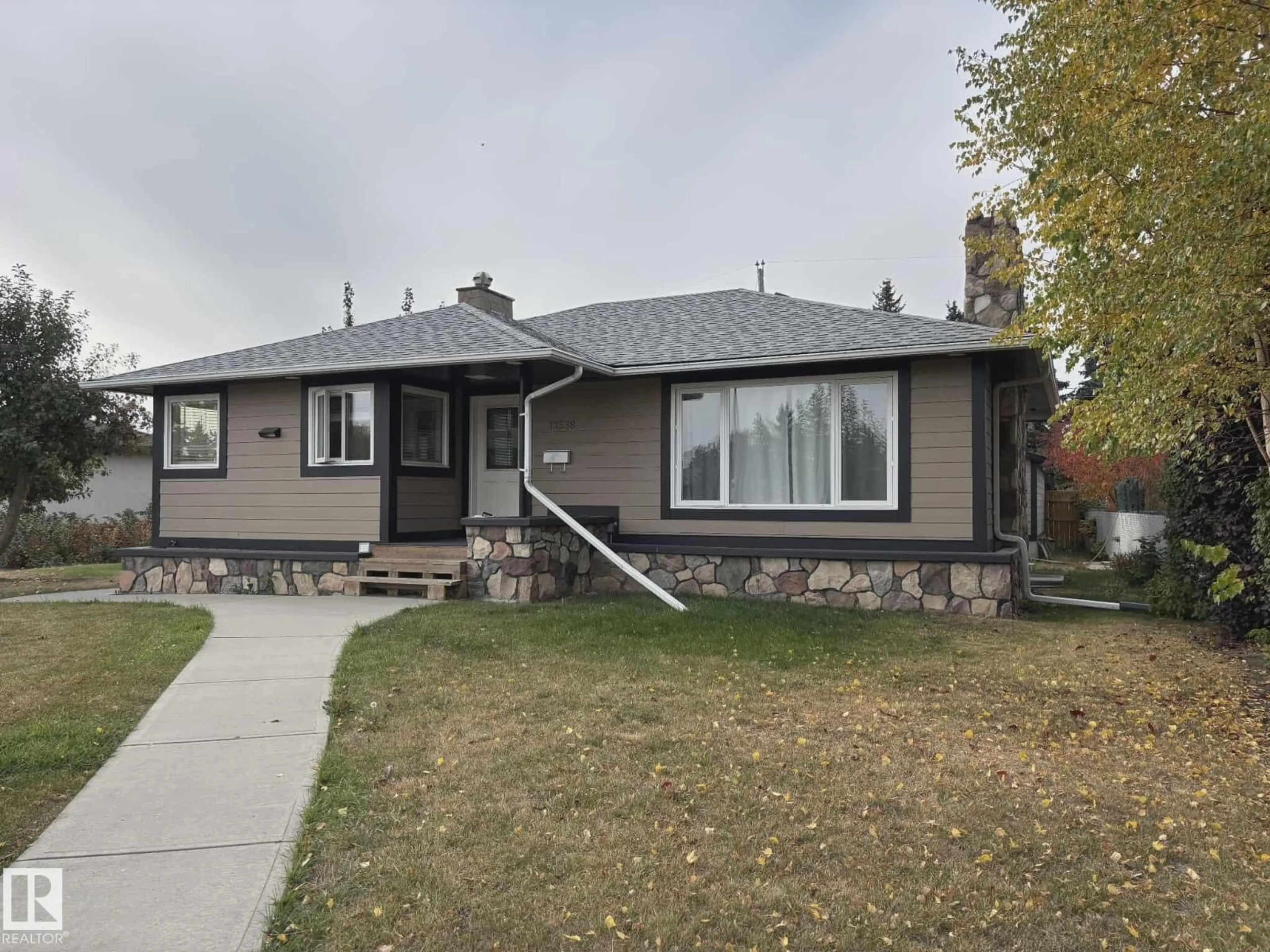 Home with vinyl exterior material, street for NW - 13538 127 ST, Edmonton Alberta T5L1B9