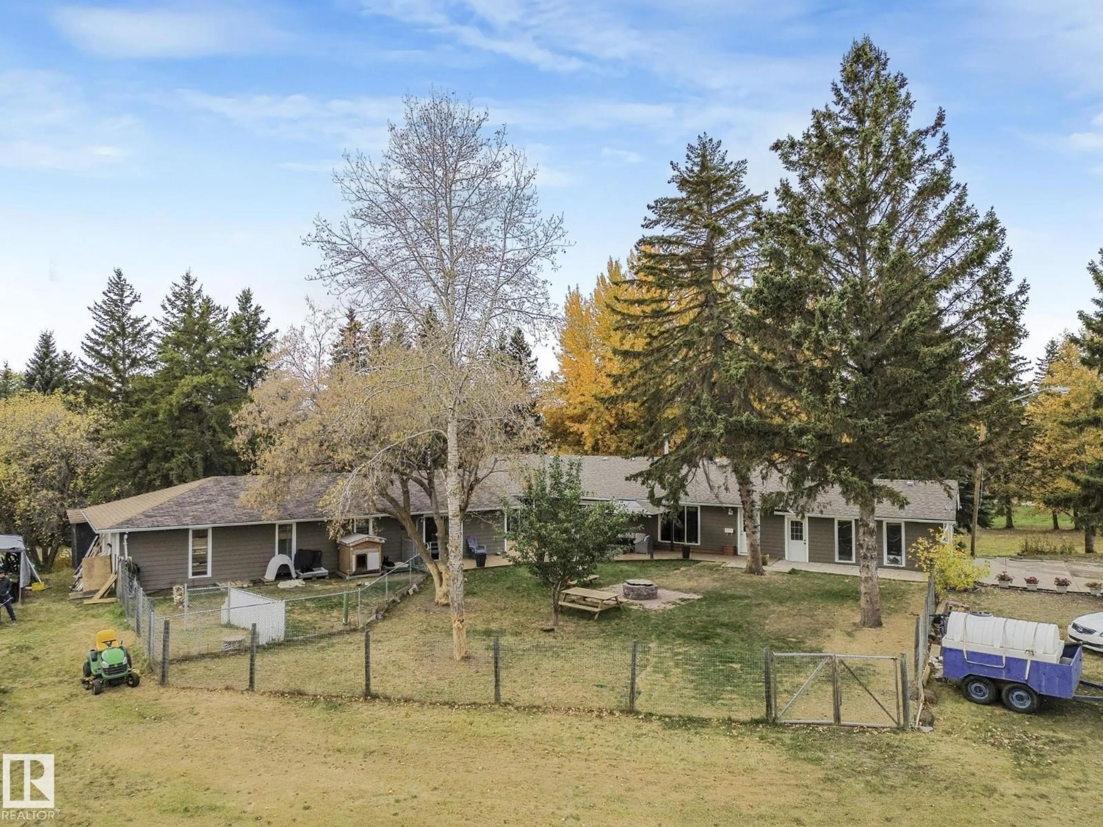 A pic from outside/outdoor area/front of a property/back of a property/a pic from drone, mountain view for 37 - 52249 RANGE ROAD 233, Rural Strathcona County Alberta T8B1C7