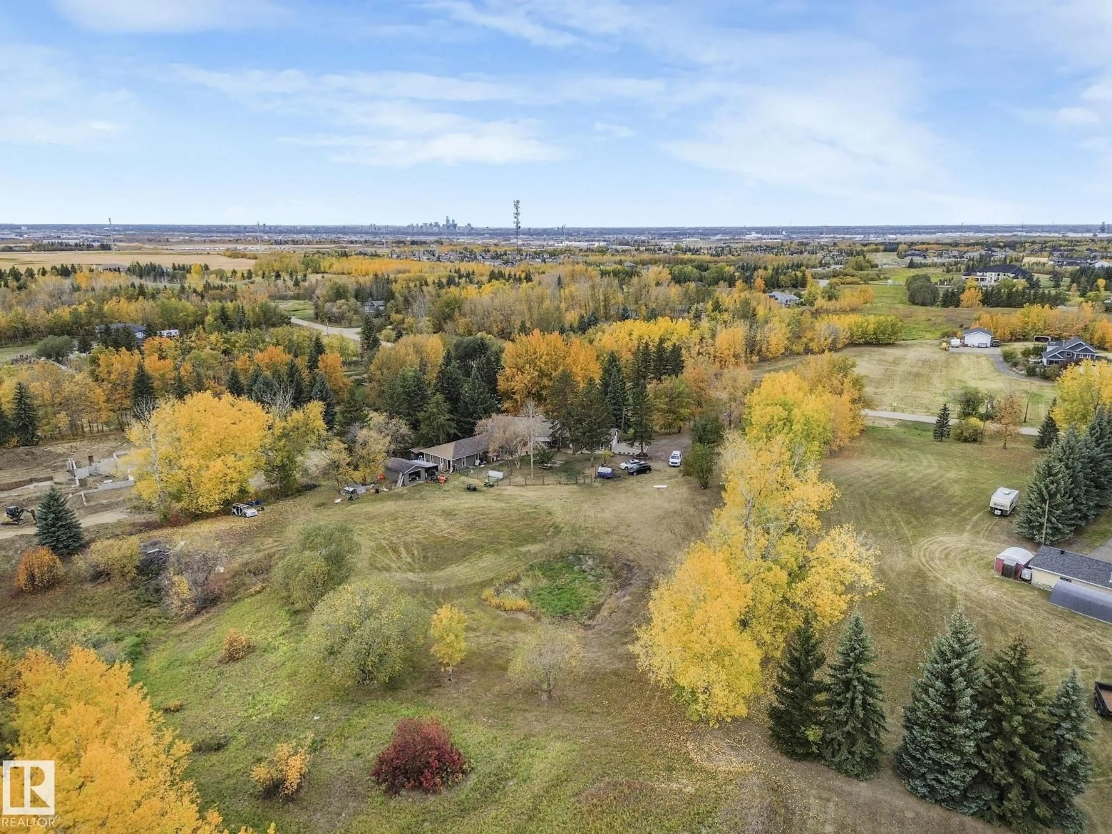 A pic from outside/outdoor area/front of a property/back of a property/a pic from drone, forest/trees view for 37 - 52249 RANGE ROAD 233, Rural Strathcona County Alberta T8B1C7